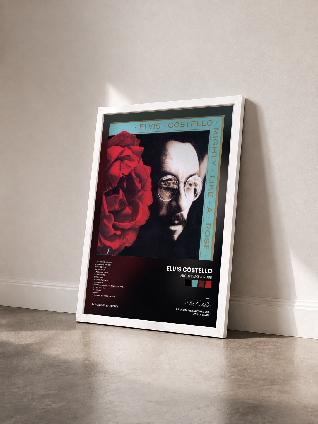 #blanc Tableau de l'album Mighty Like A Rose de Elvis Costello vu de trois quarts, cadre blanc
