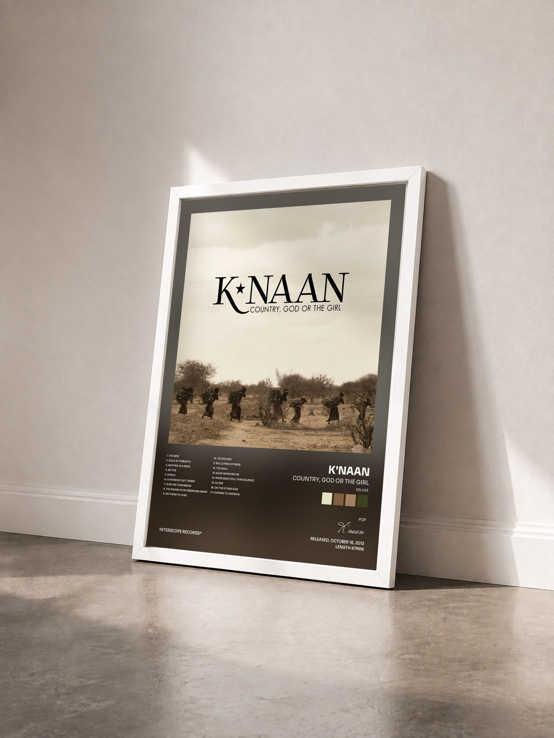 #blanc Tableau de l'album Country, God Or The Girl (Deluxe) de K'naan vu de trois quarts, cadre blanc