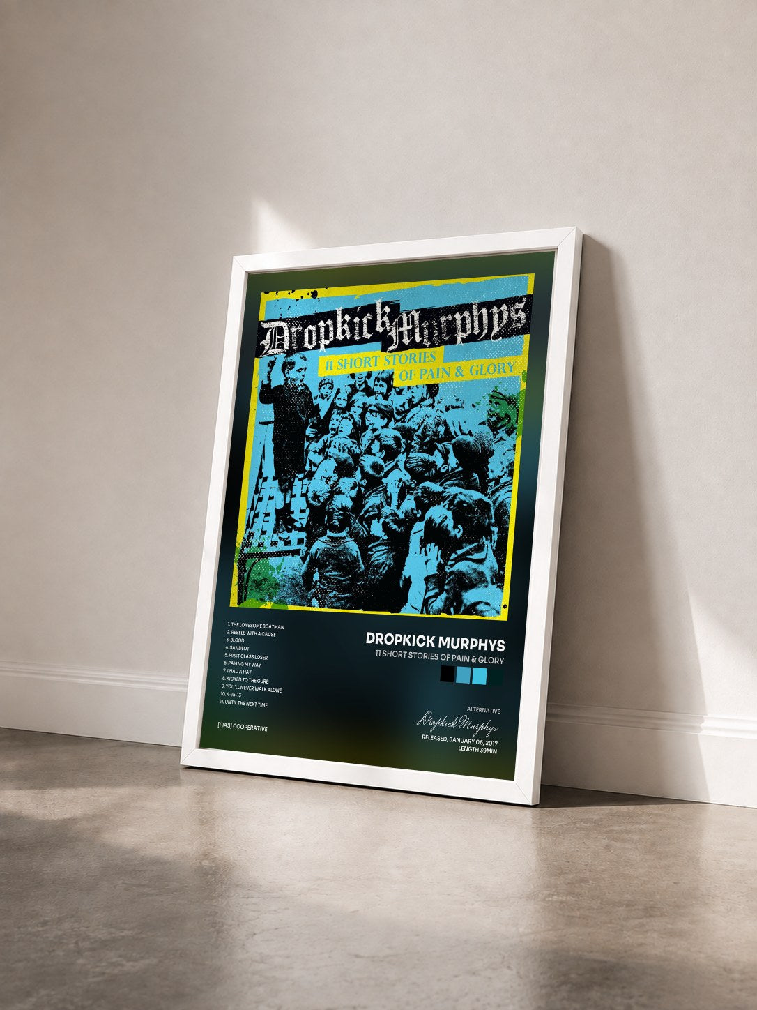 #blanc Tableau de l'album 11 Short Stories of Pain & Glory de Dropkick Murphys vu de trois quarts, cadre blanc