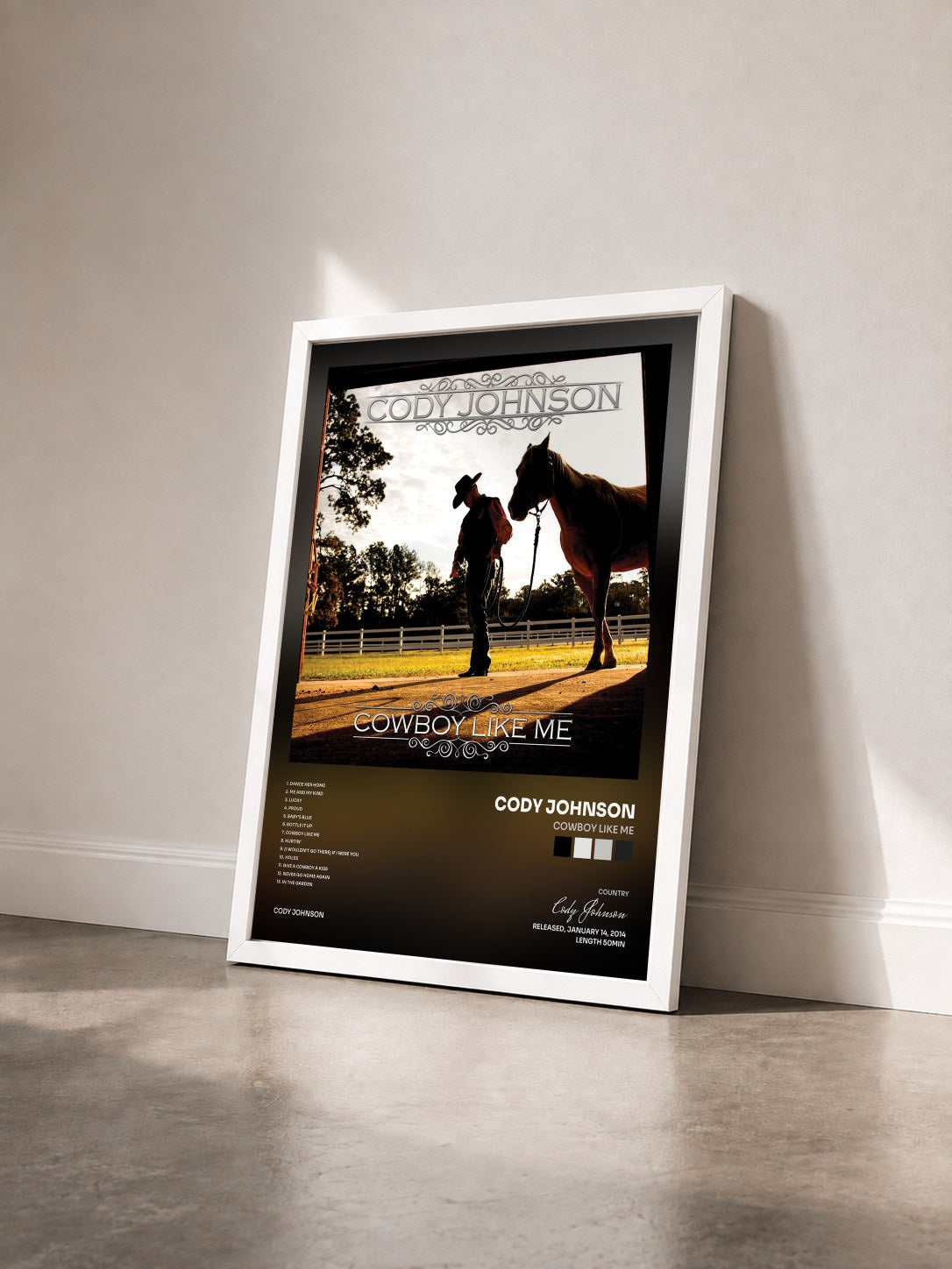 #blanc Tableau de l'album Cowboy Like Me de Cody Johnson vu de trois quarts, cadre blanc