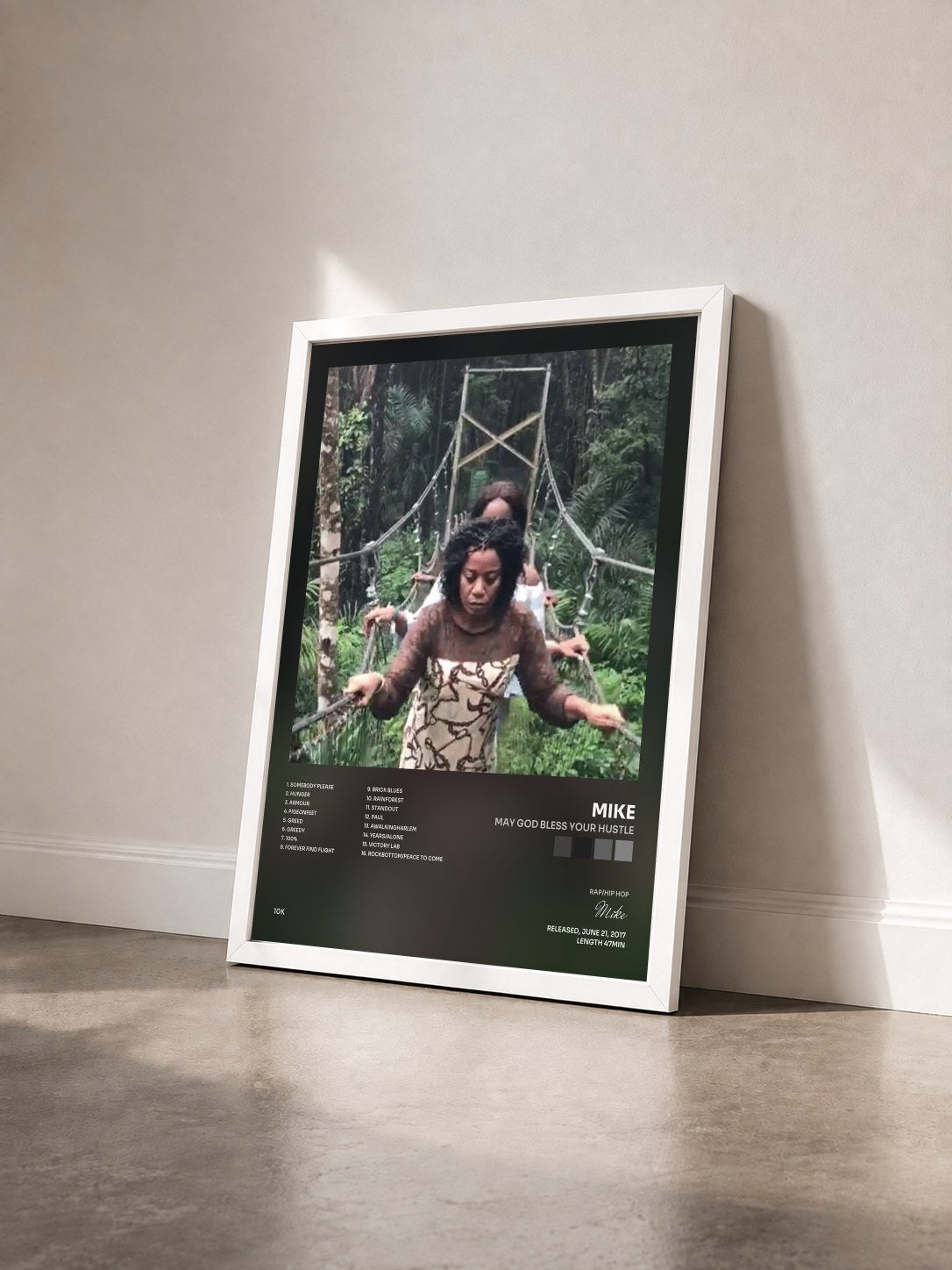 #blanc Tableau de l'album MAY GOD BLESS YOUR HUSTLE de Mike vu de trois quarts, cadre blanc