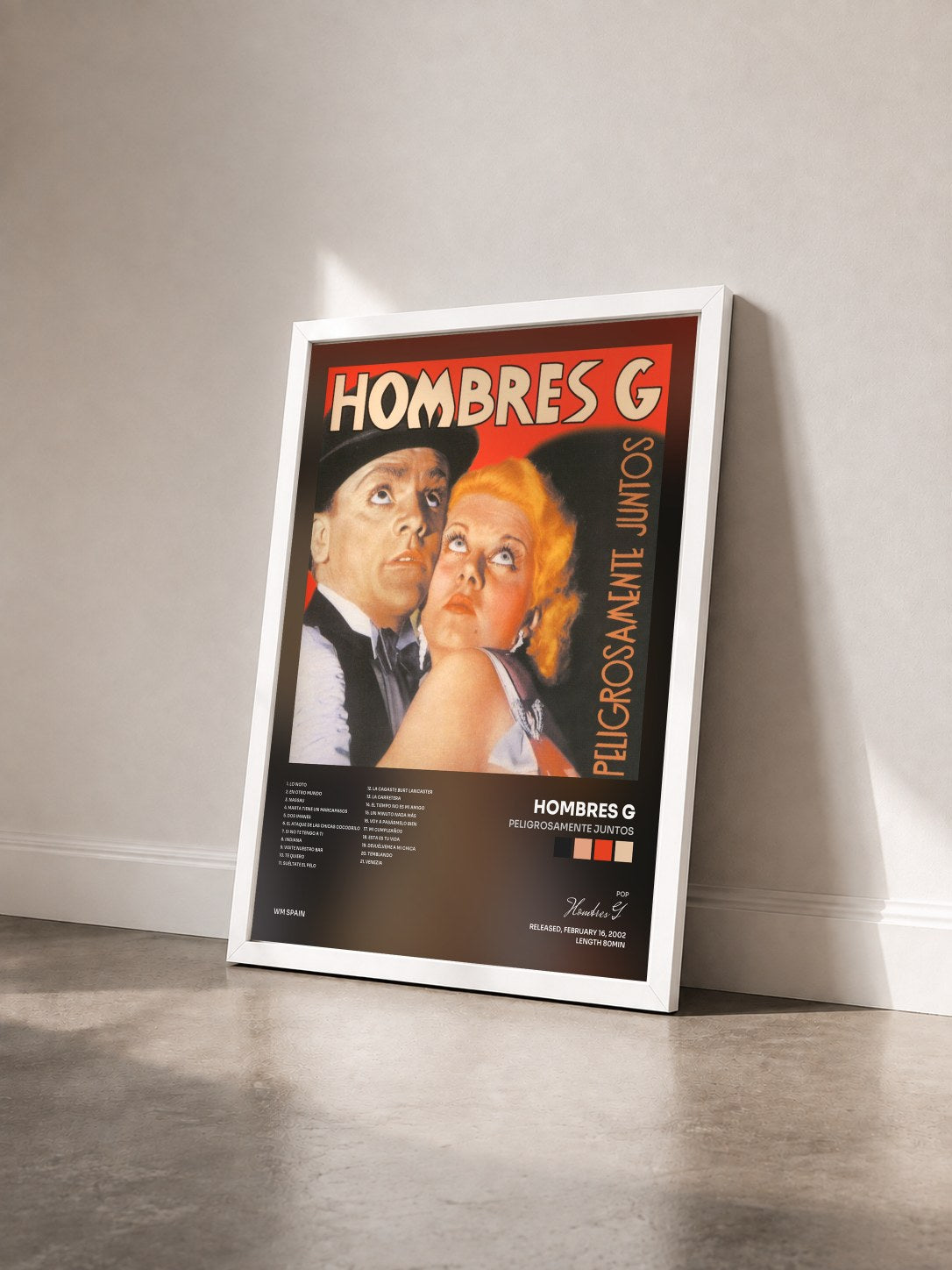 #blanc Tableau de l'album Peligrosamente Juntos de Hombres G vu de trois quarts, cadre blanc