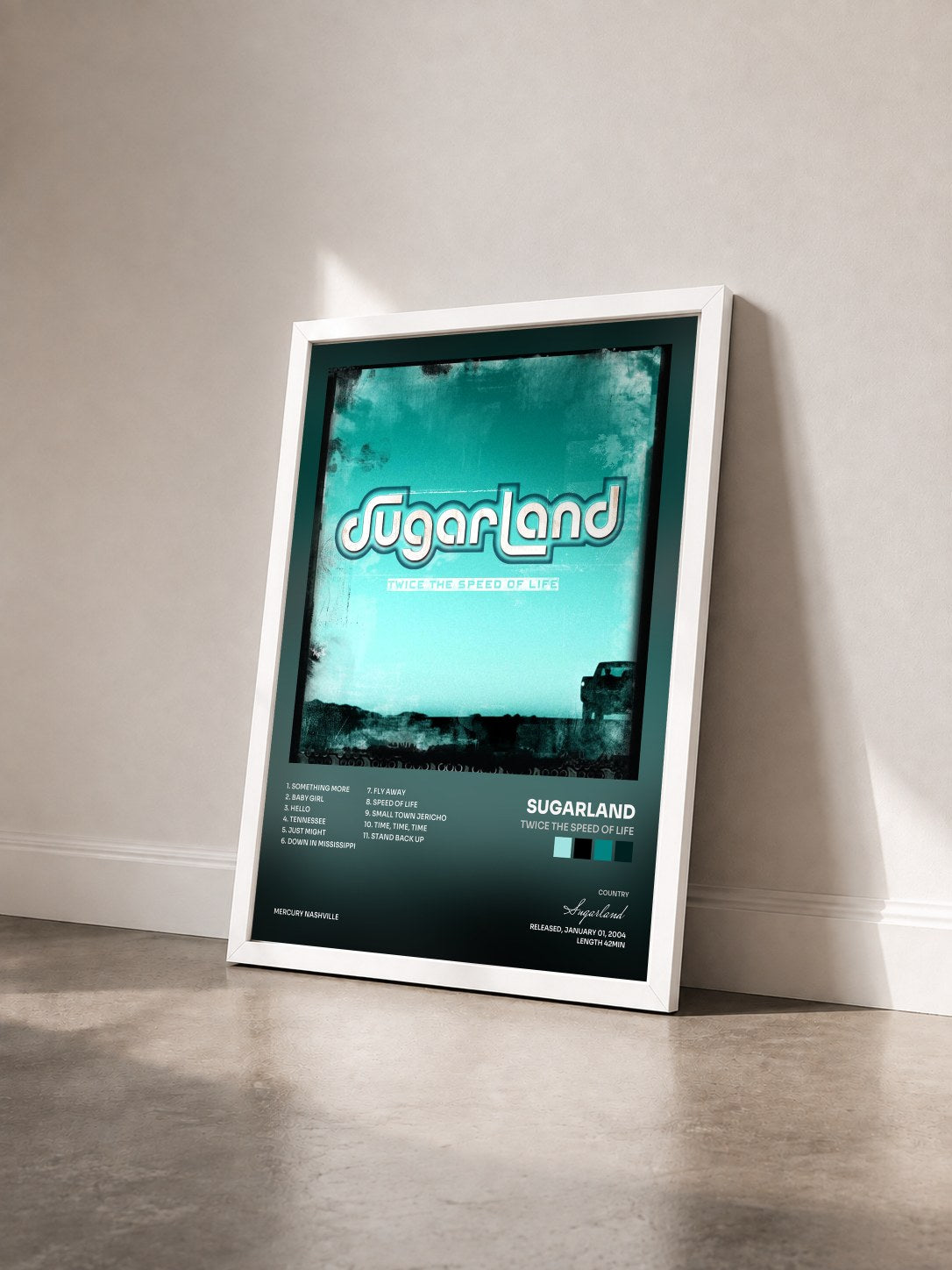 #blanc Tableau de l'album Twice The Speed Of Life de Sugarland vu de trois quarts, cadre blanc