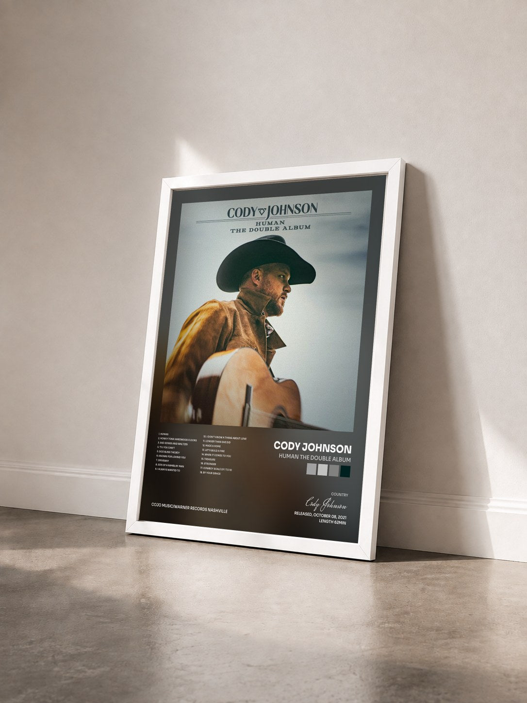#blanc Tableau de l'album Human The Double Album de Cody Johnson vu de trois quarts, cadre blanc