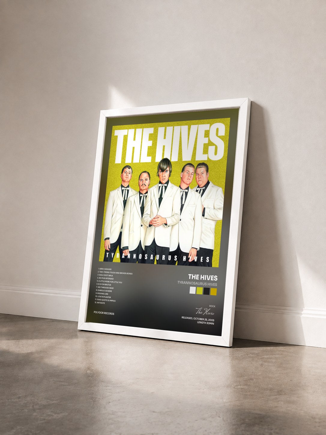 #blanc Tableau de l'album Tyrannosaurus Hives de The Hives vu de trois quarts, cadre blanc