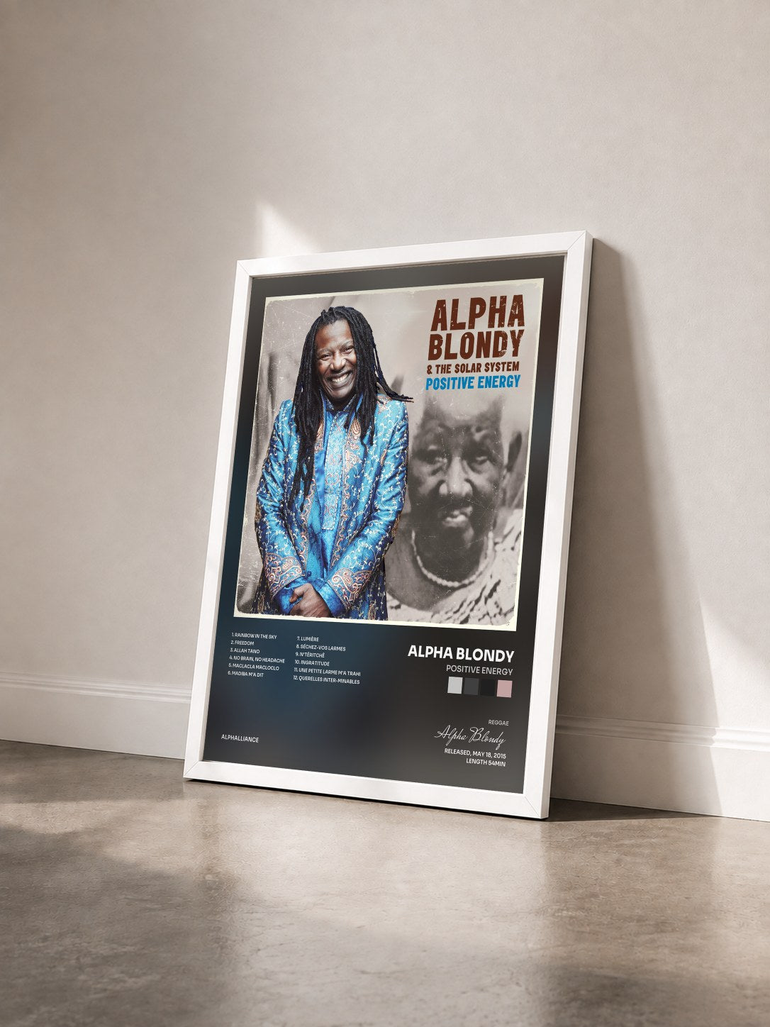 #blanc Tableau de l'album Positive Energy de Alpha Blondy vu de trois quarts, cadre blanc