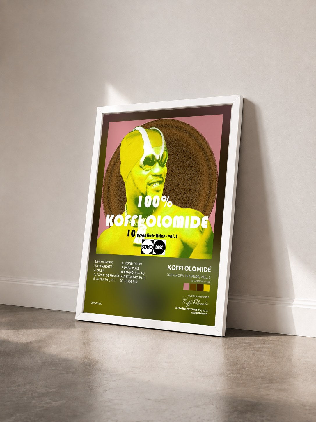 #blanc Tableau de l'album 100% Koffi Olomide, vol. 3 (10 Essential Titles) de Koffi Olomidé vu de trois quarts, cadre blanc