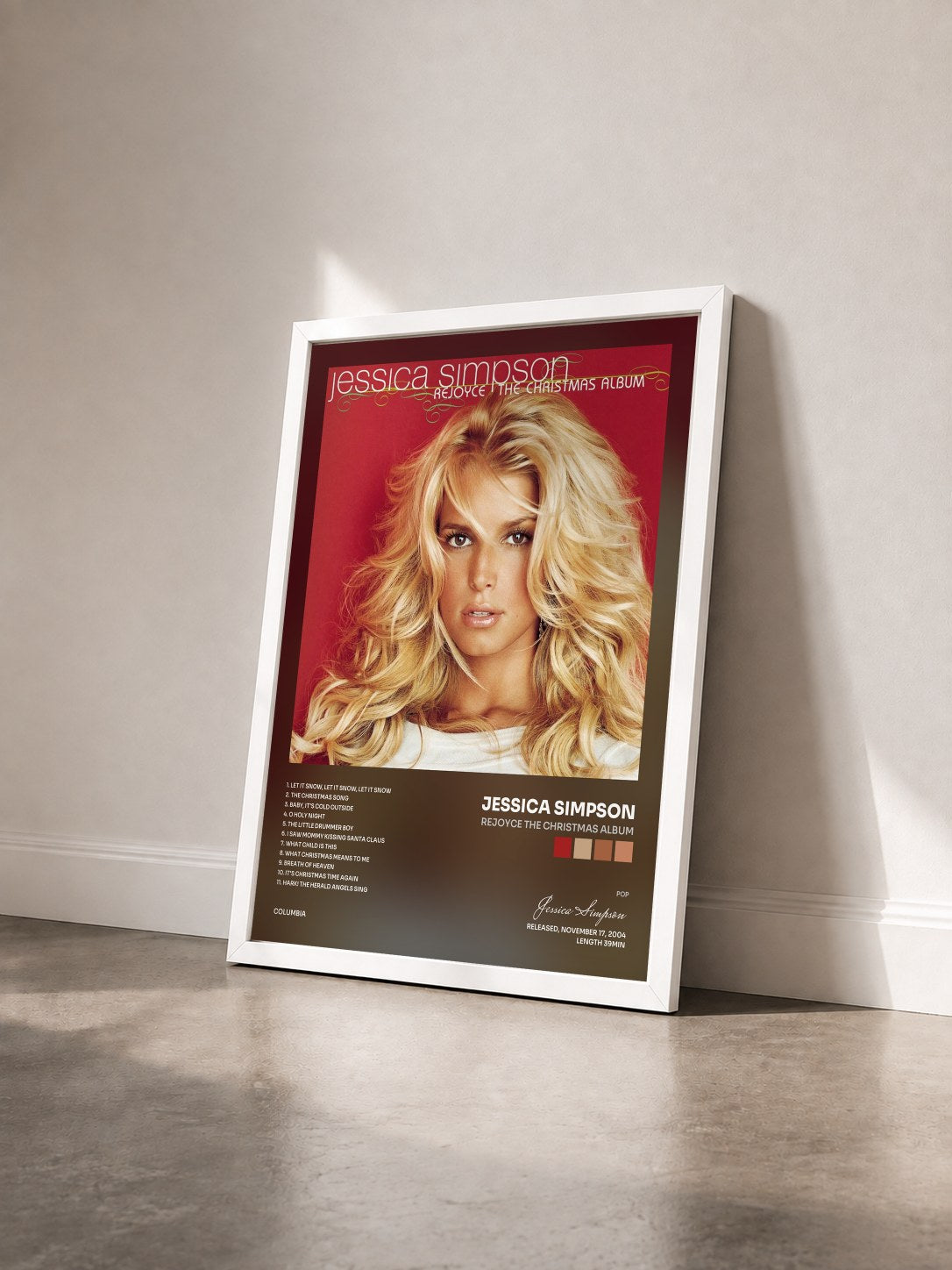 #blanc Tableau de l'album ReJoyce The Christmas Album de Jessica Simpson vu de trois quarts, cadre blanc