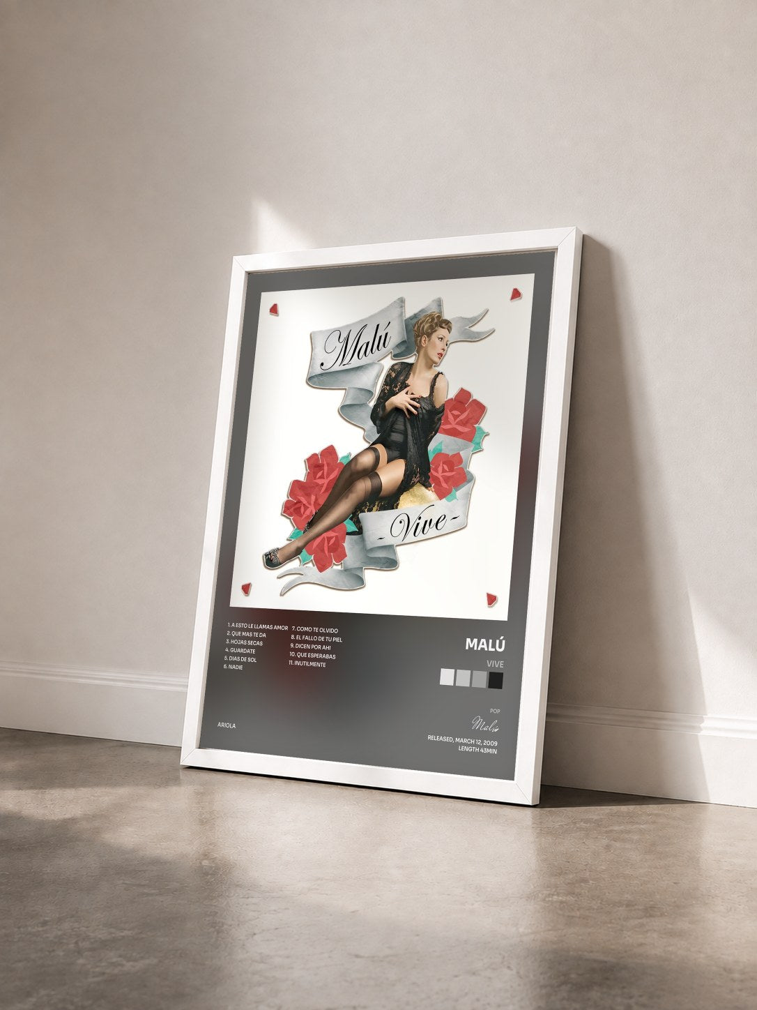 #blanc Tableau de l'album Vive de Malú vu de trois quarts, cadre blanc