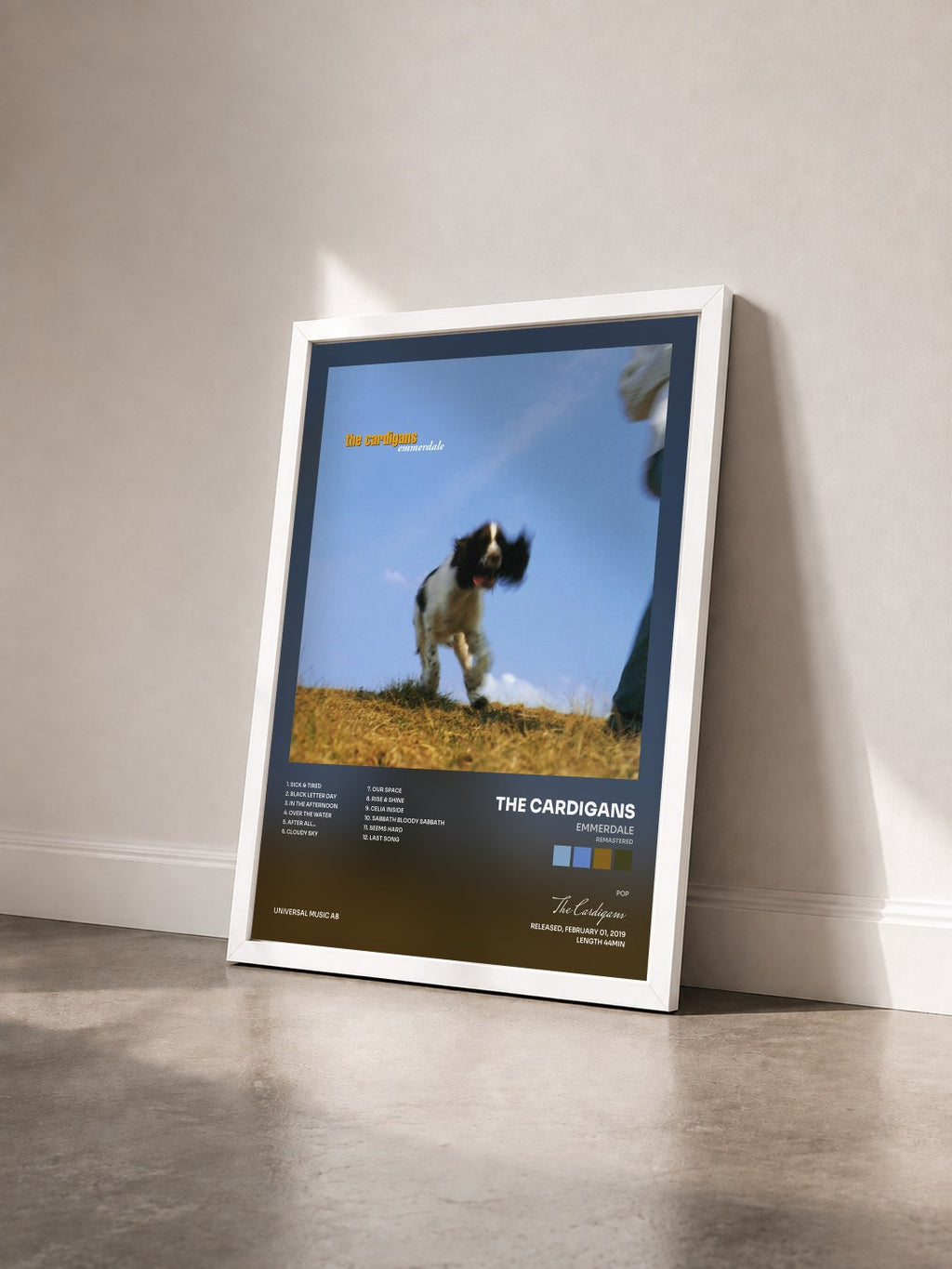 #blanc Emmerdale (Remastered) by The Cardigans as a framed art print seen at an angle, white frame