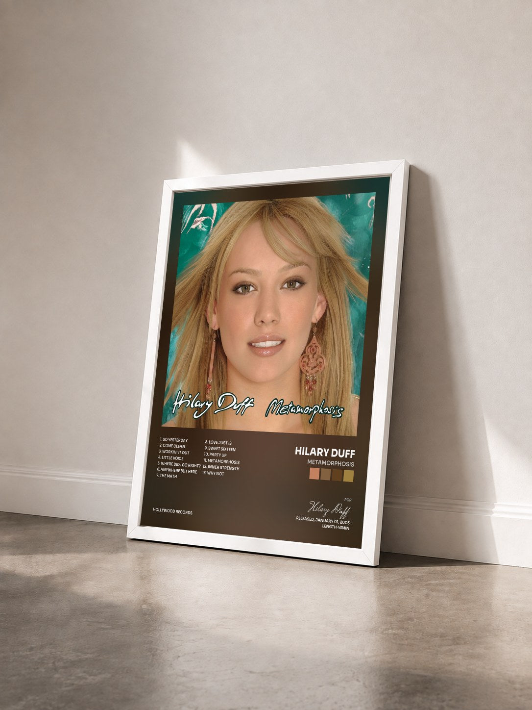 #blanc Tableau de l'album Metamorphosis de Hilary Duff vu de trois quarts, cadre blanc