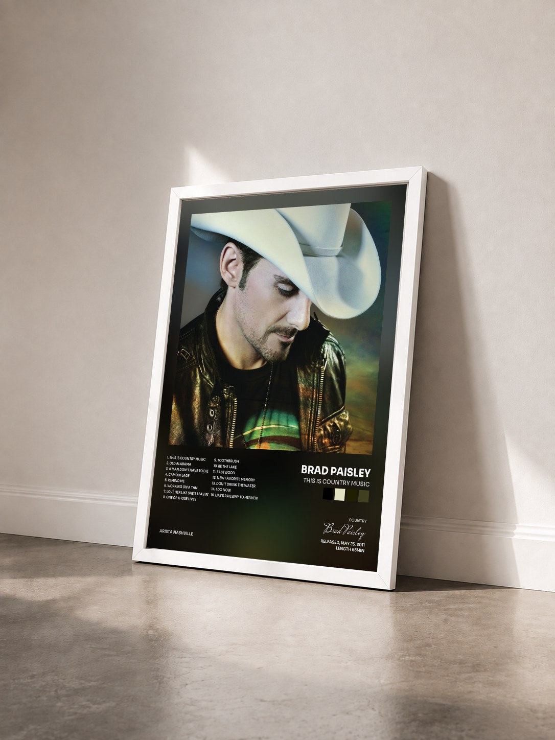 #blanc Tableau de l'album This Is Country Music de Brad Paisley vu de trois quarts, cadre blanc