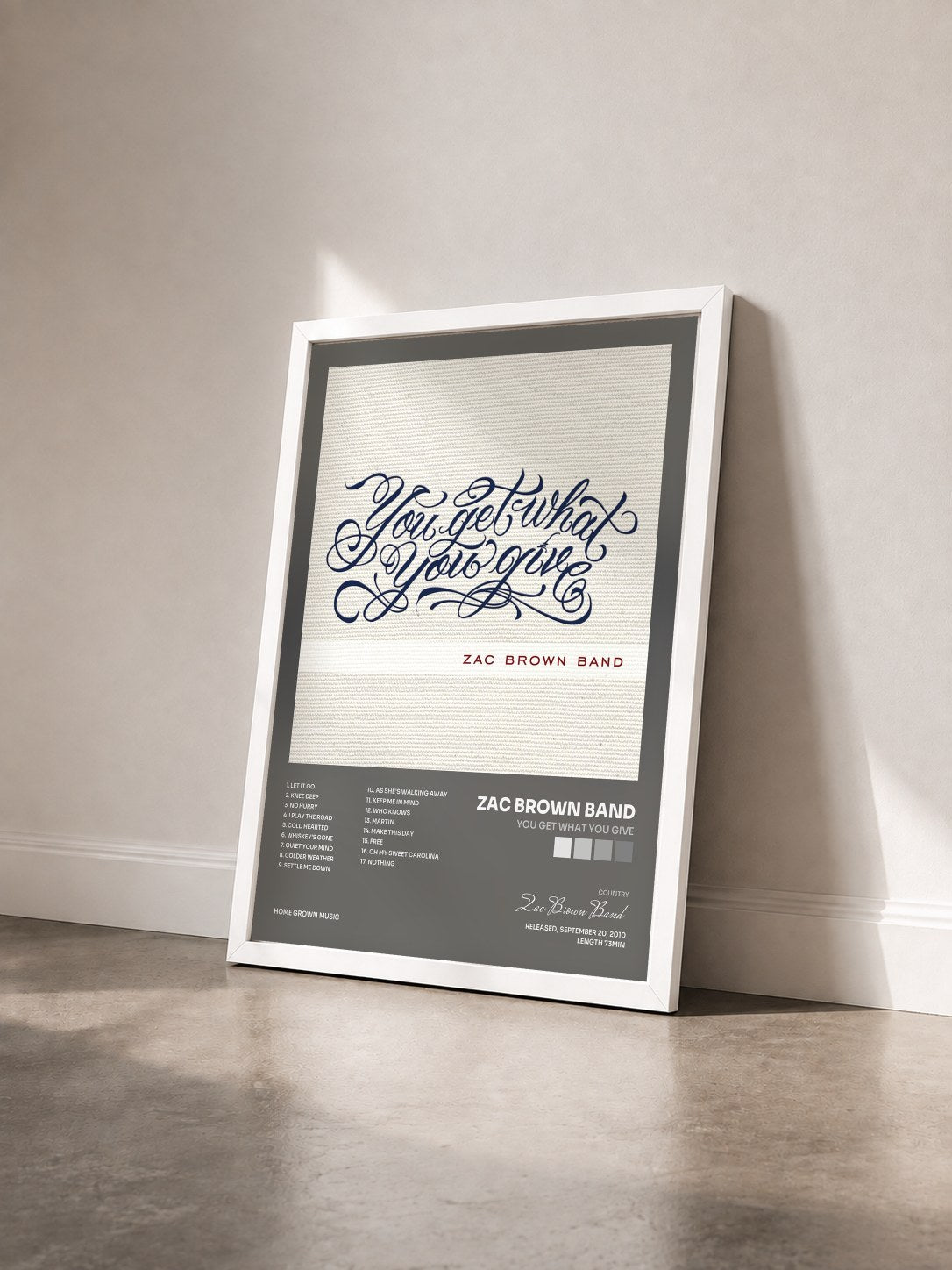 #blanc Tableau de l'album You Get What You Give de Zac Brown Band vu de trois quarts, cadre blanc