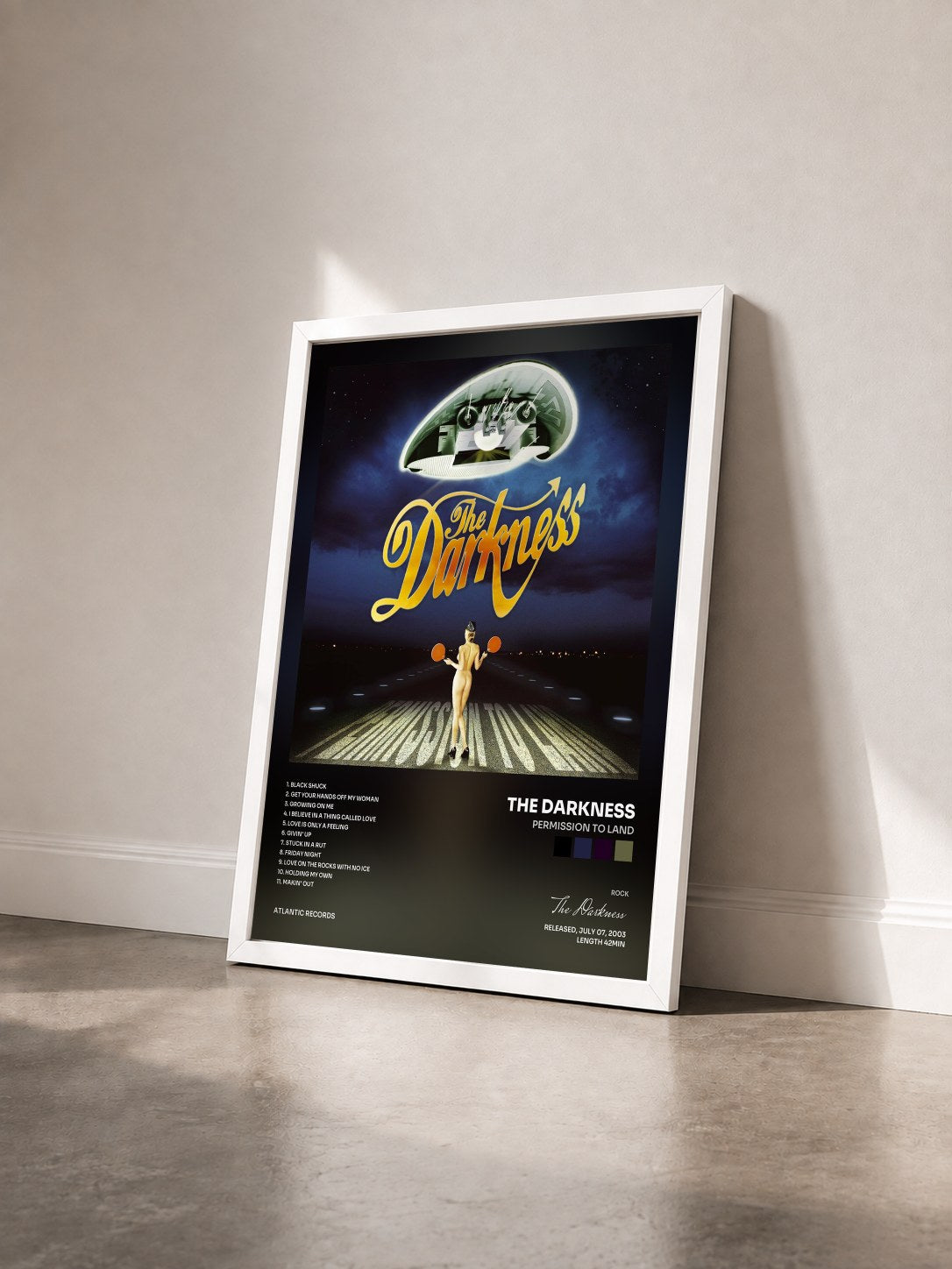 #blanc Tableau de l'album Permission to Land de The Darkness vu de trois quarts, cadre blanc