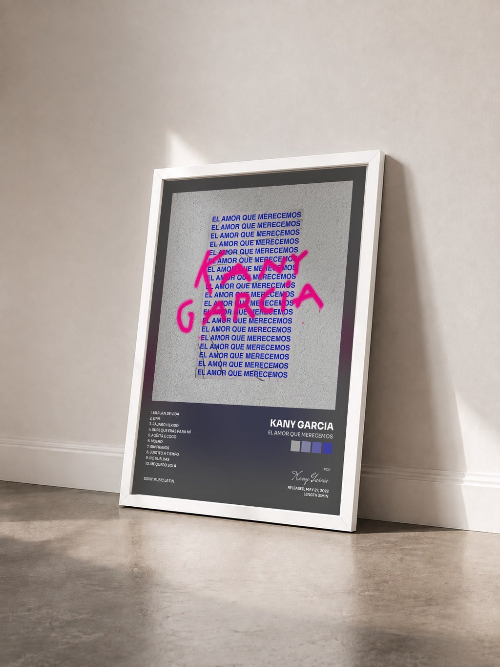 #blanc El Amor Que Merecemos by Kany Garcia as a framed art print seen at an angle, white frame