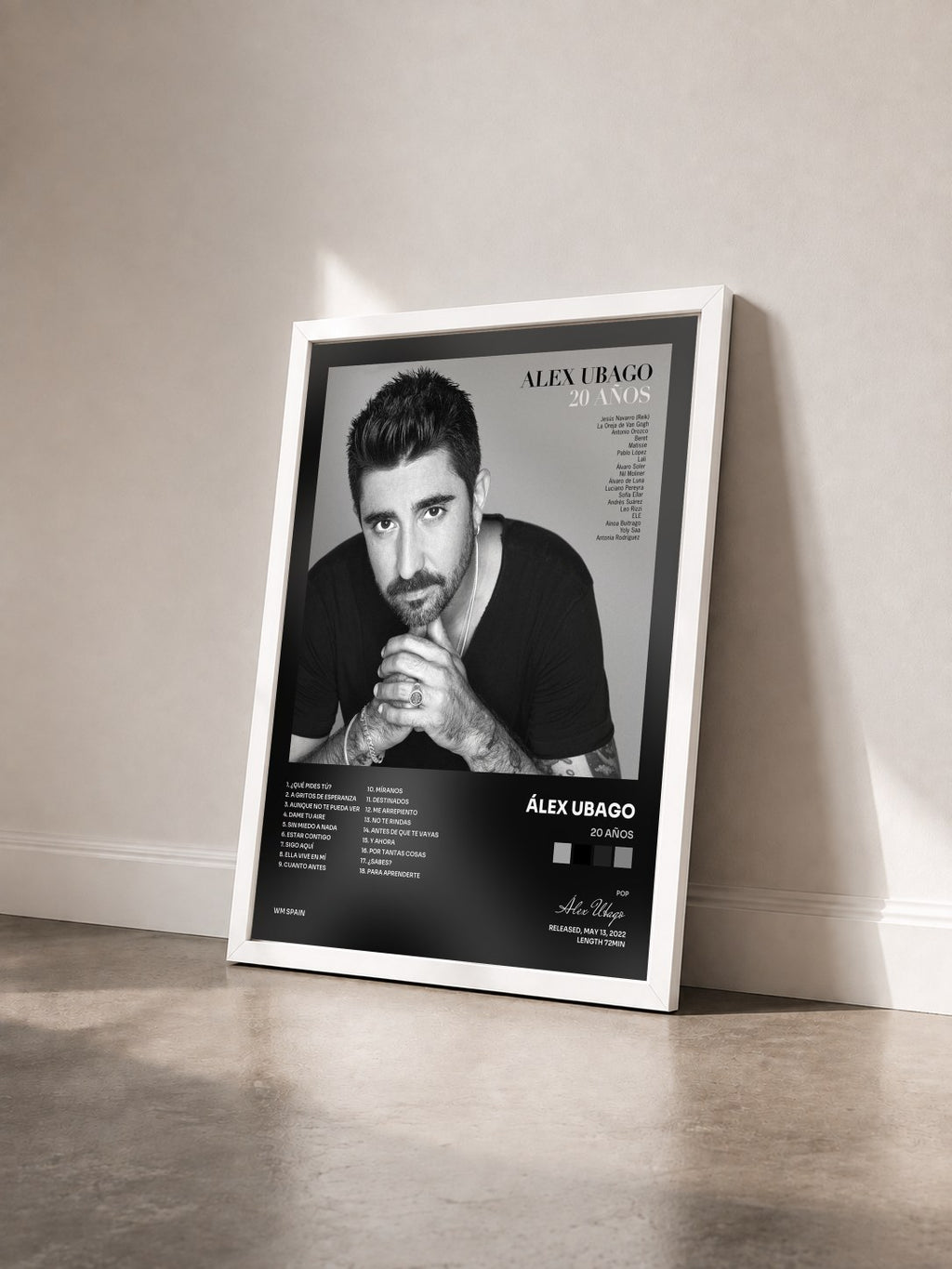 #blanc 20 Años by Álex Ubago as a framed art print seen at an angle, white frame