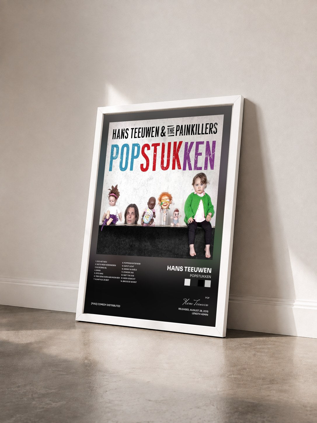 #blanc Tableau de l'album Popstukken de Hans Teeuwen vu de trois quarts, cadre blanc