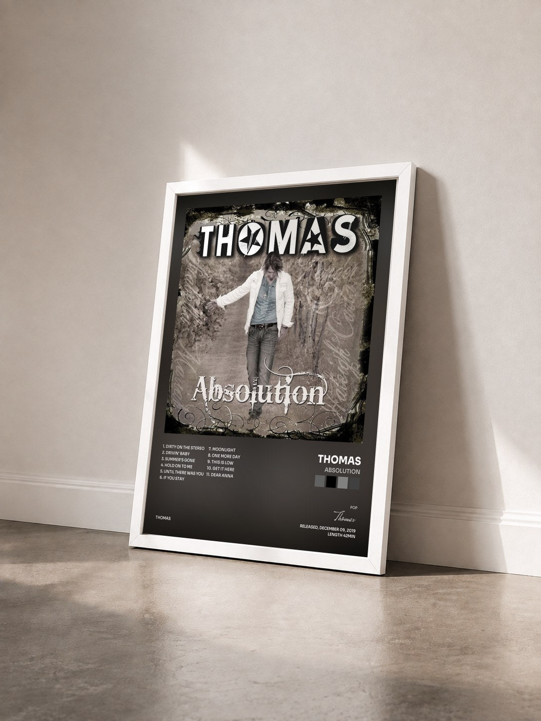 #blanc Tableau de l'album Absolution de Thomas vu de trois quarts, cadre blanc
