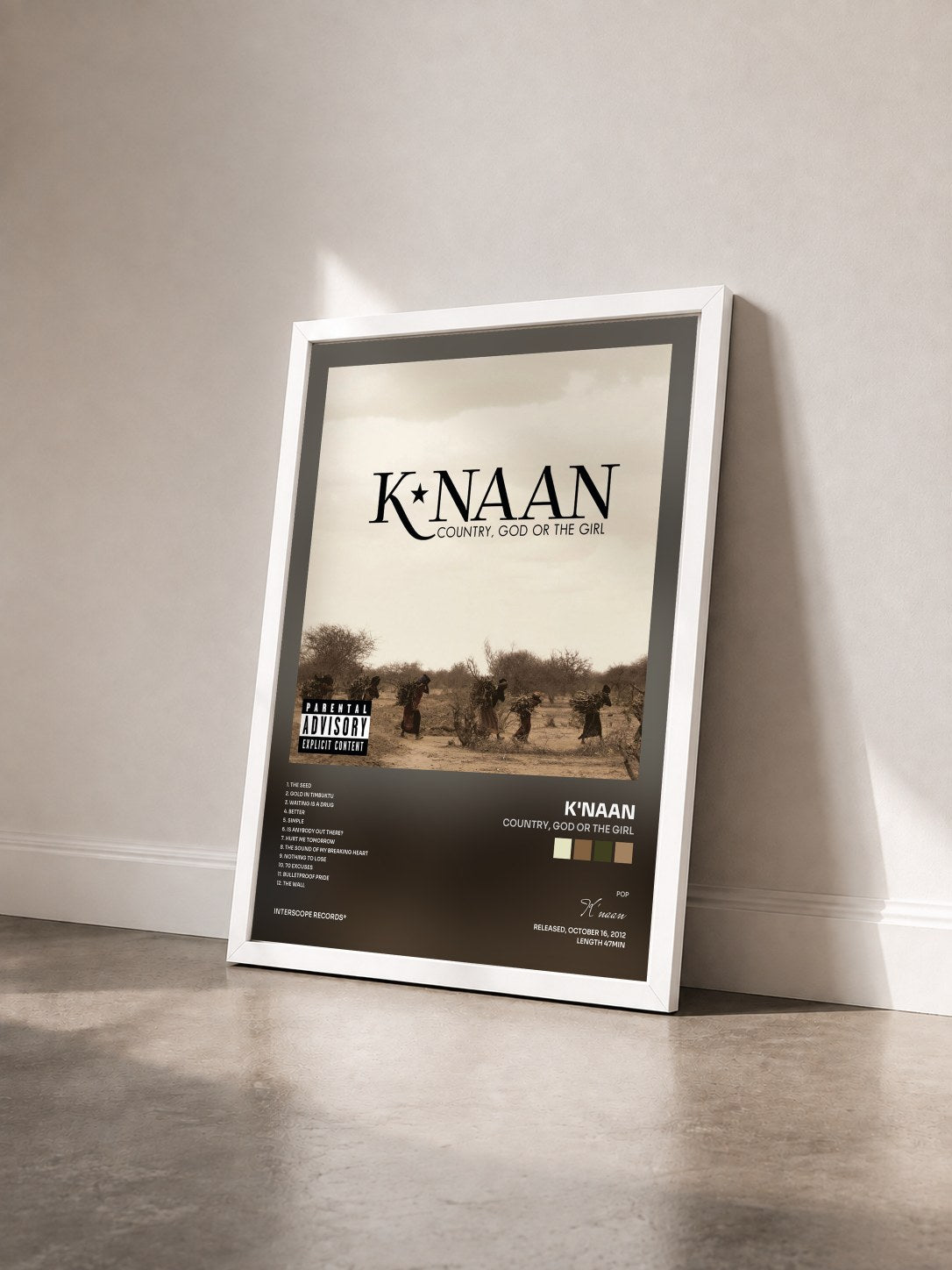 #blanc Tableau de l'album Country, God Or The Girl de K'naan vu de trois quarts, cadre blanc