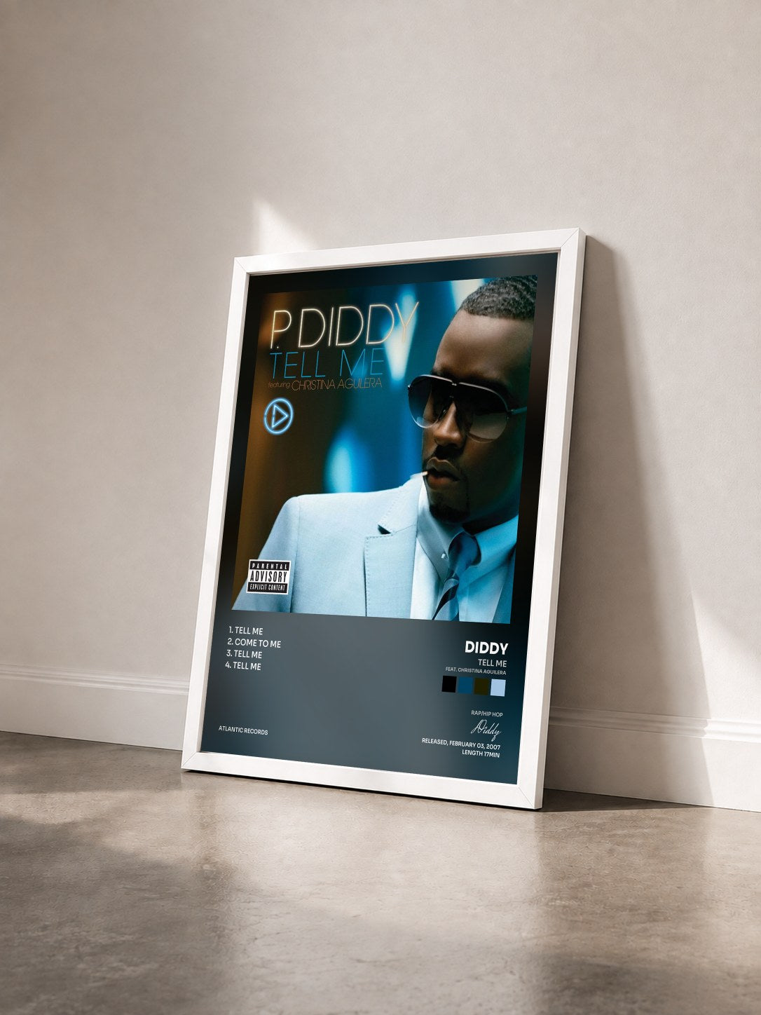 #blanc Tableau de l'album Tell Me (feat. Christina Aguilera) de Diddy vu de trois quarts, cadre blanc