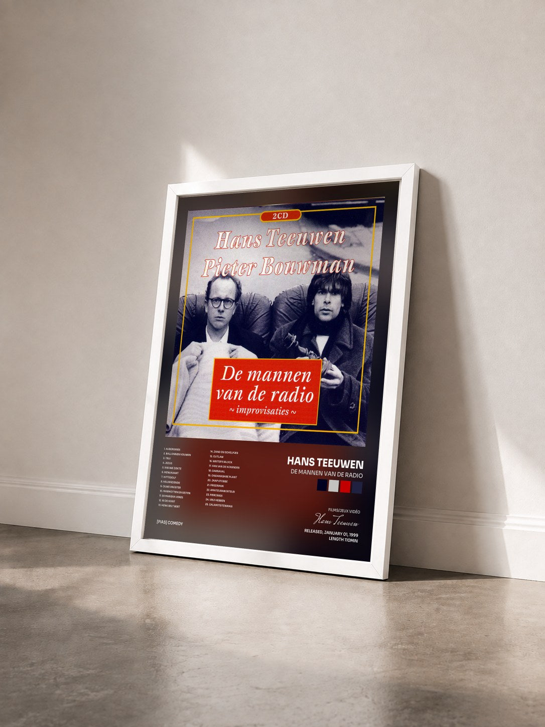 #blanc Tableau de l'album De Mannen Van De Radio de Hans Teeuwen vu de trois quarts, cadre blanc