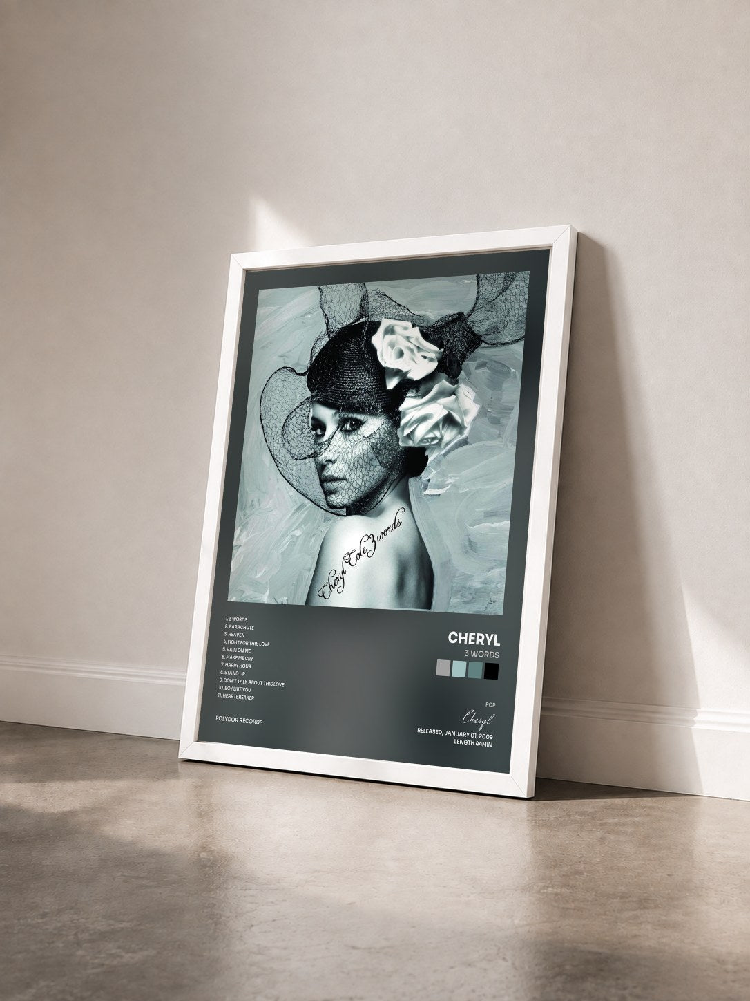 #blanc Tableau de l'album 3 Words de Cheryl vu de trois quarts, cadre blanc