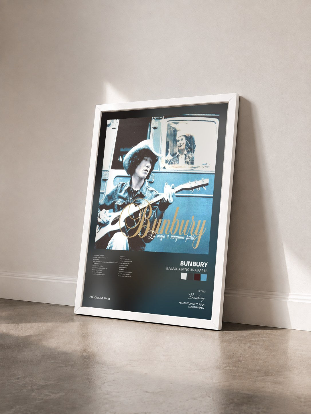 #blanc Tableau de l'album El Viaje A Ninguna Parte de Bunbury vu de trois quarts, cadre blanc