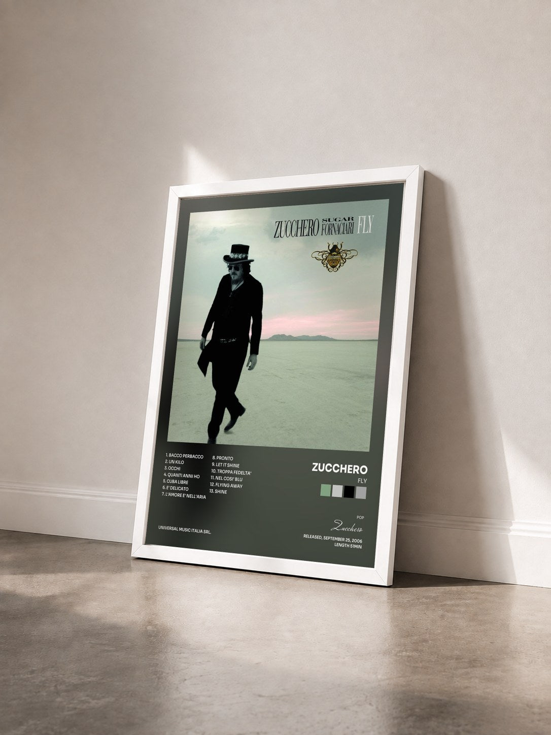 #blanc Tableau de l'album Fly de Zucchero vu de trois quarts, cadre blanc