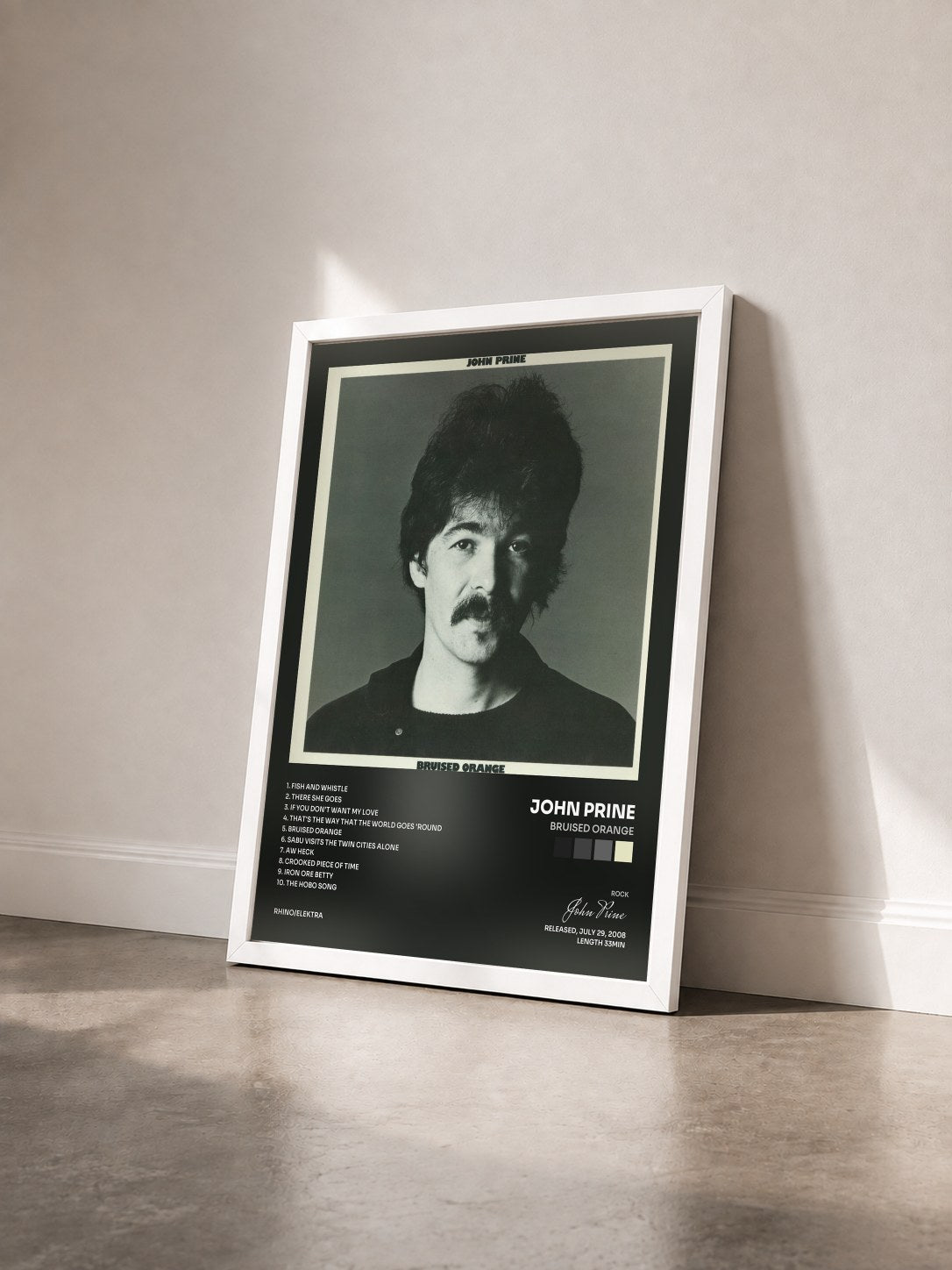 #blanc Tableau de l'album Bruised Orange de John Prine vu de trois quarts, cadre blanc