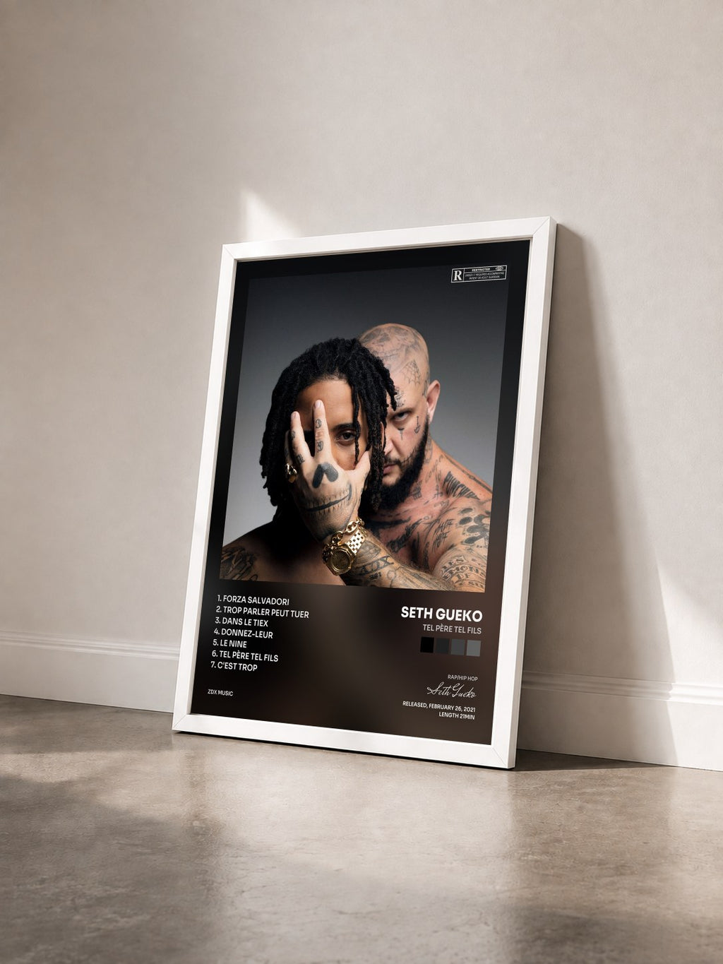 #blanc Tel père tel fils by Seth Gueko as a framed art print seen at an angle, white frame