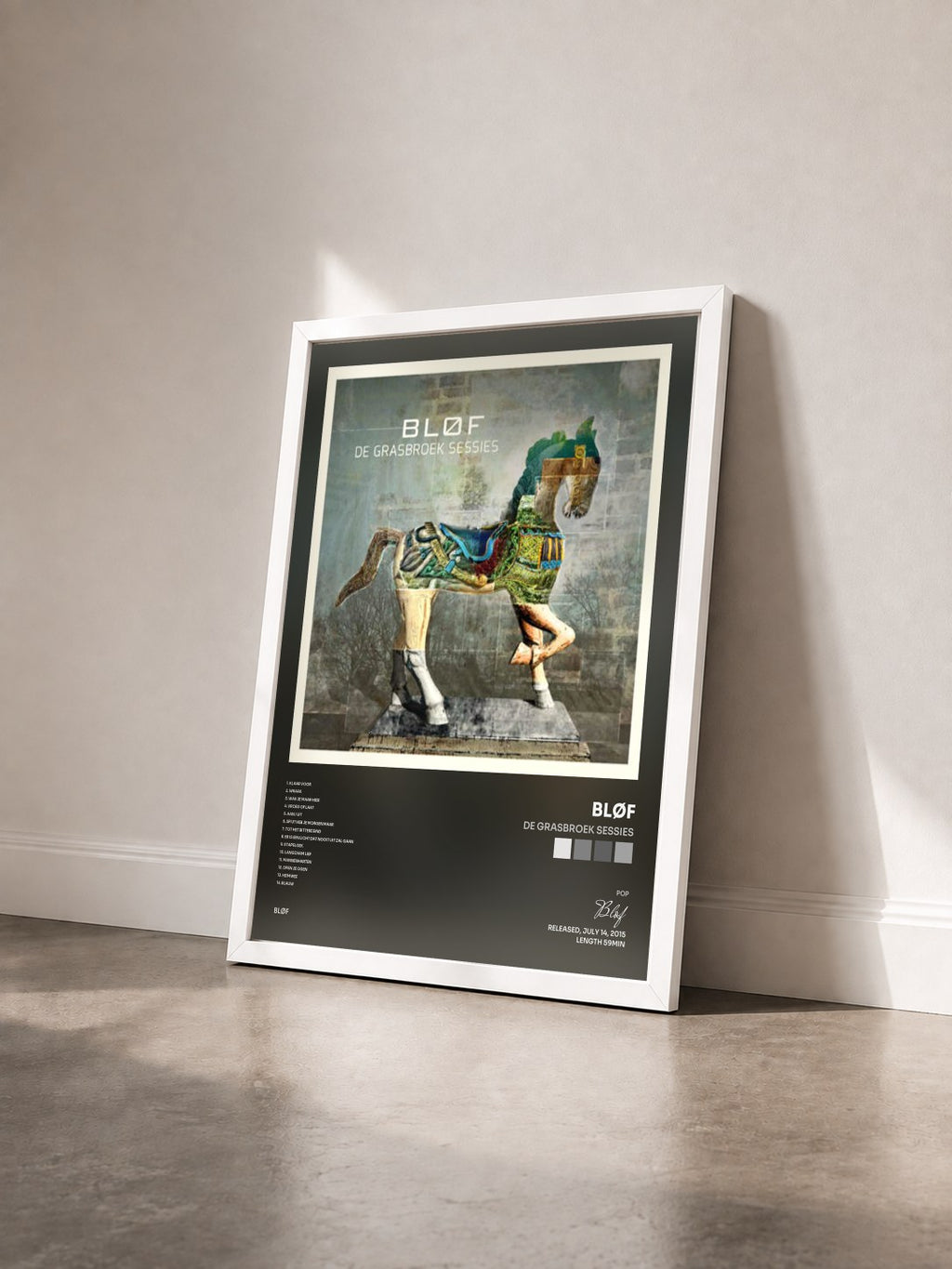 #blanc Tableau de l'album De Grasbroek Sessies de Bløf vu de trois quarts, cadre blanc
