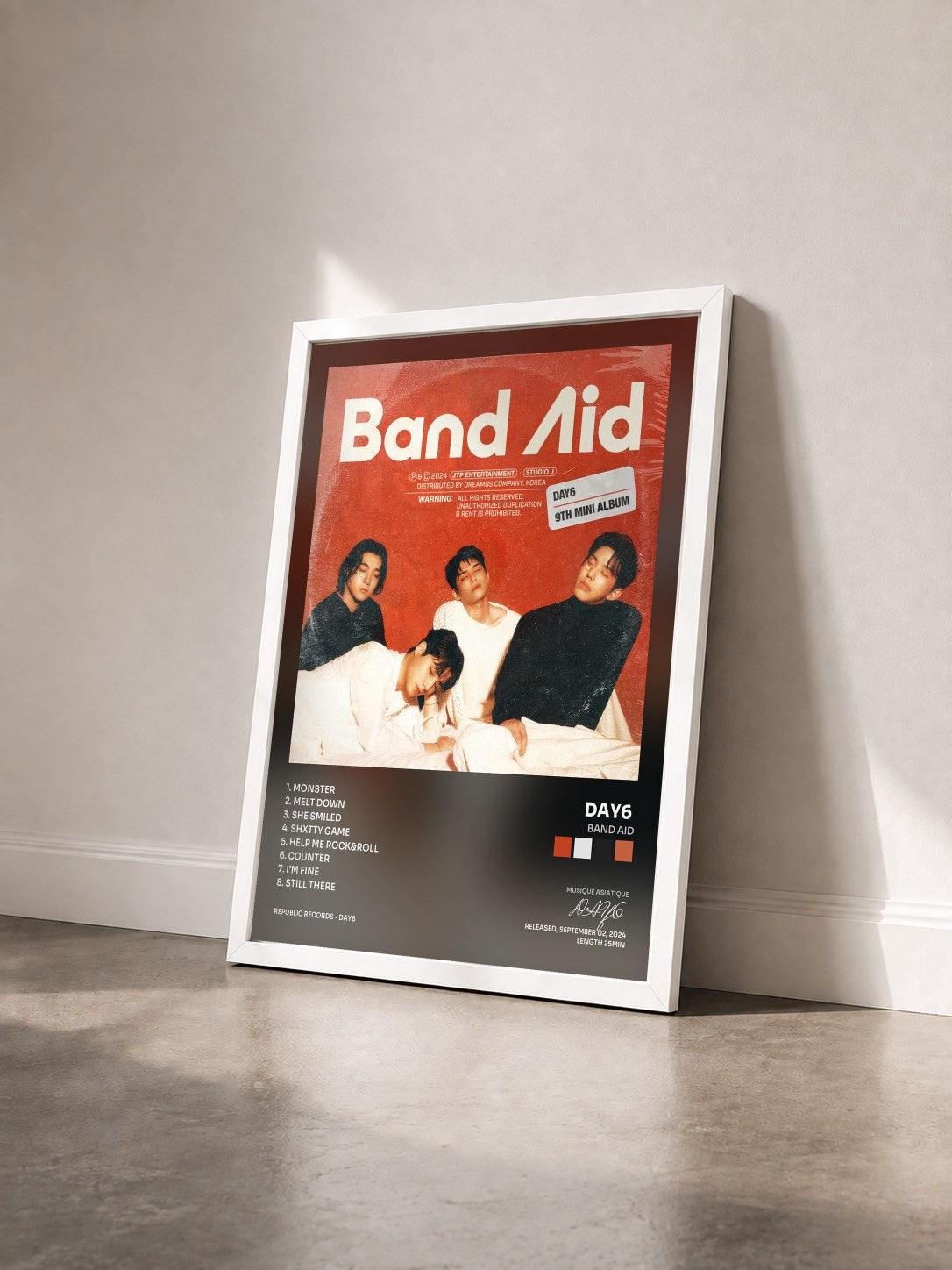 #blanc Tableau de l'album Band Aid de DAY6  vu de trois quarts, cadre blanc