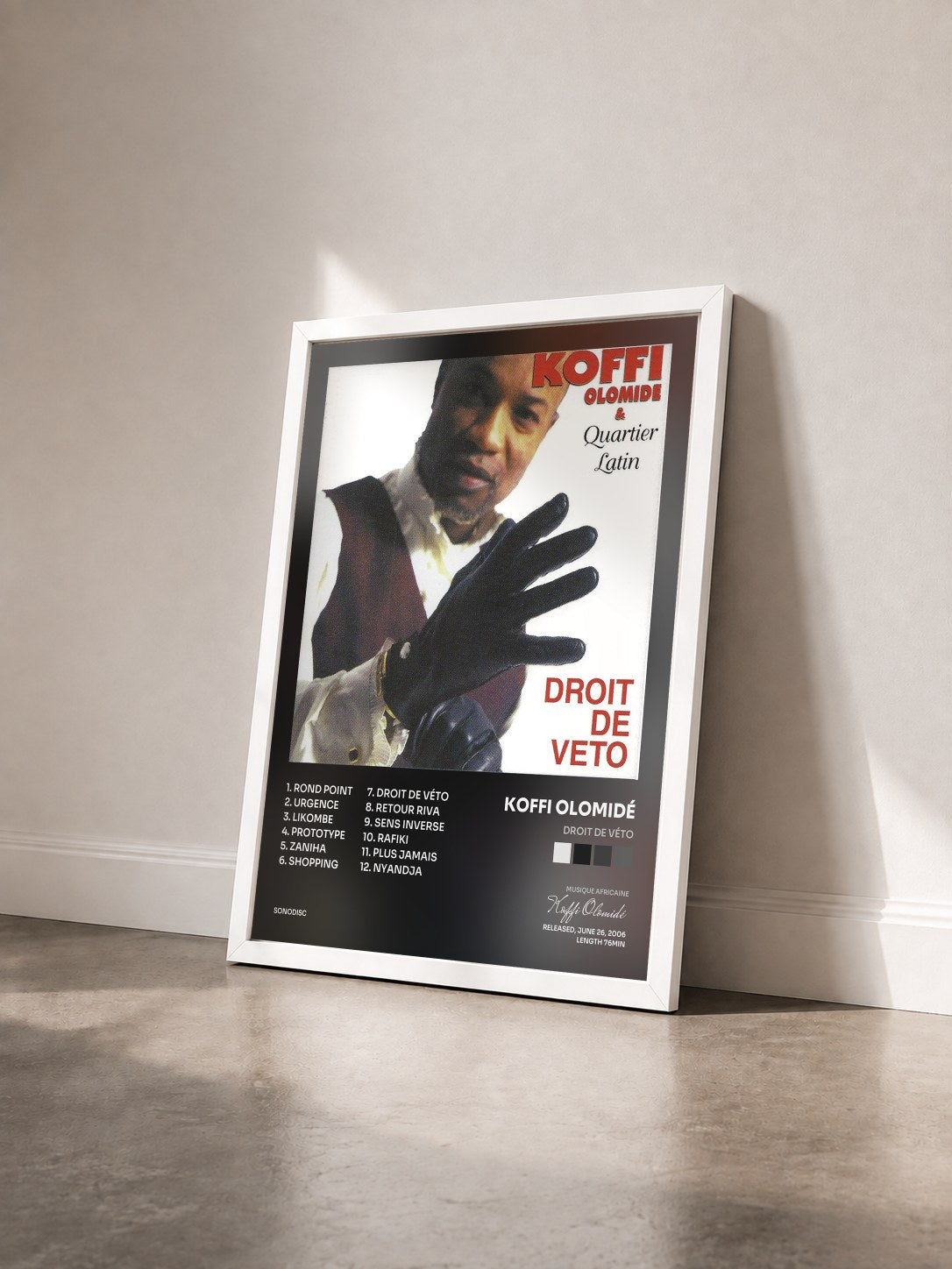 #blanc Tableau de l'album Droit de véto de Koffi Olomidé vu de trois quarts, cadre blanc