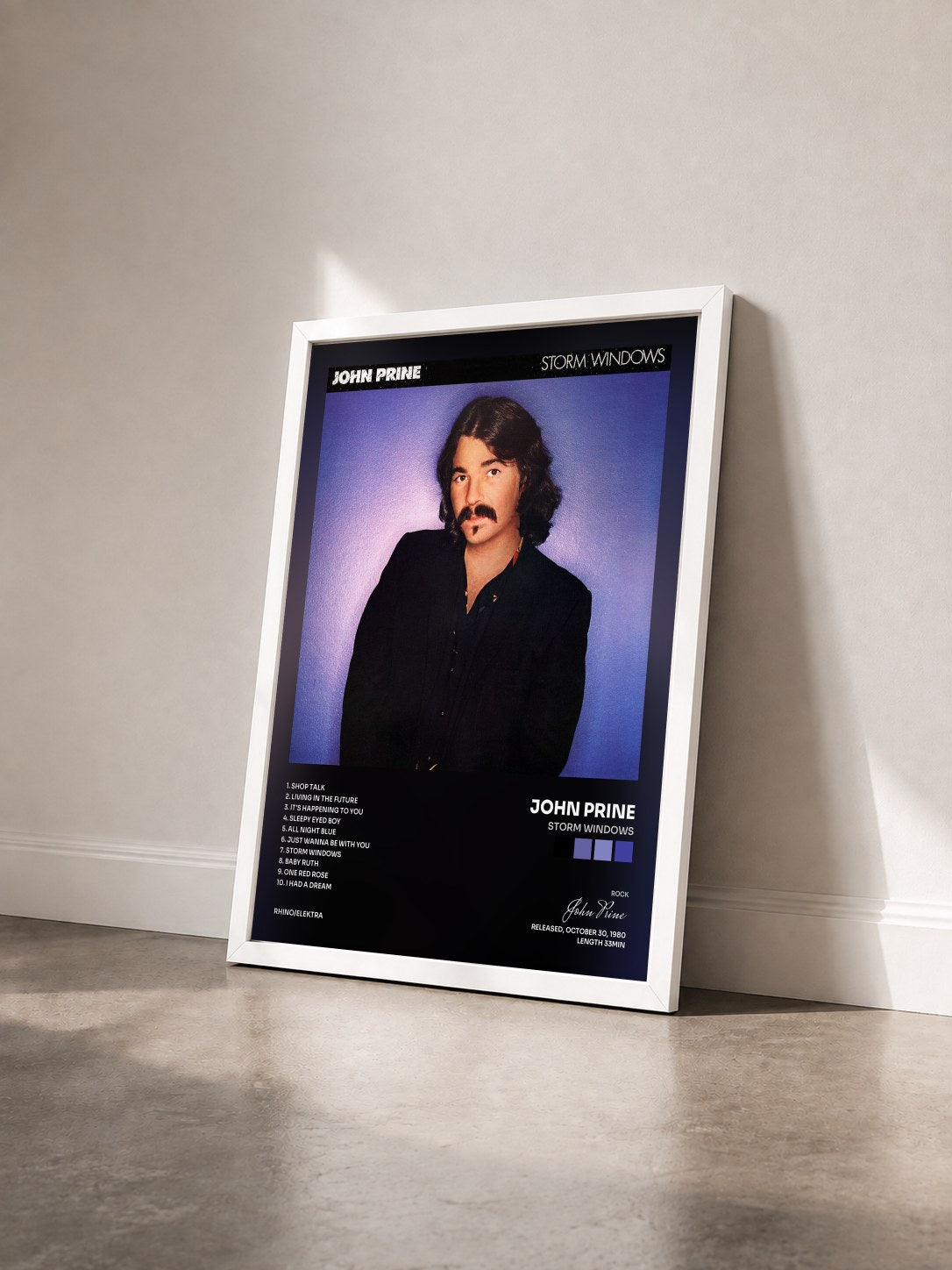 #blanc Tableau de l'album Storm Windows de John Prine vu de trois quarts, cadre blanc