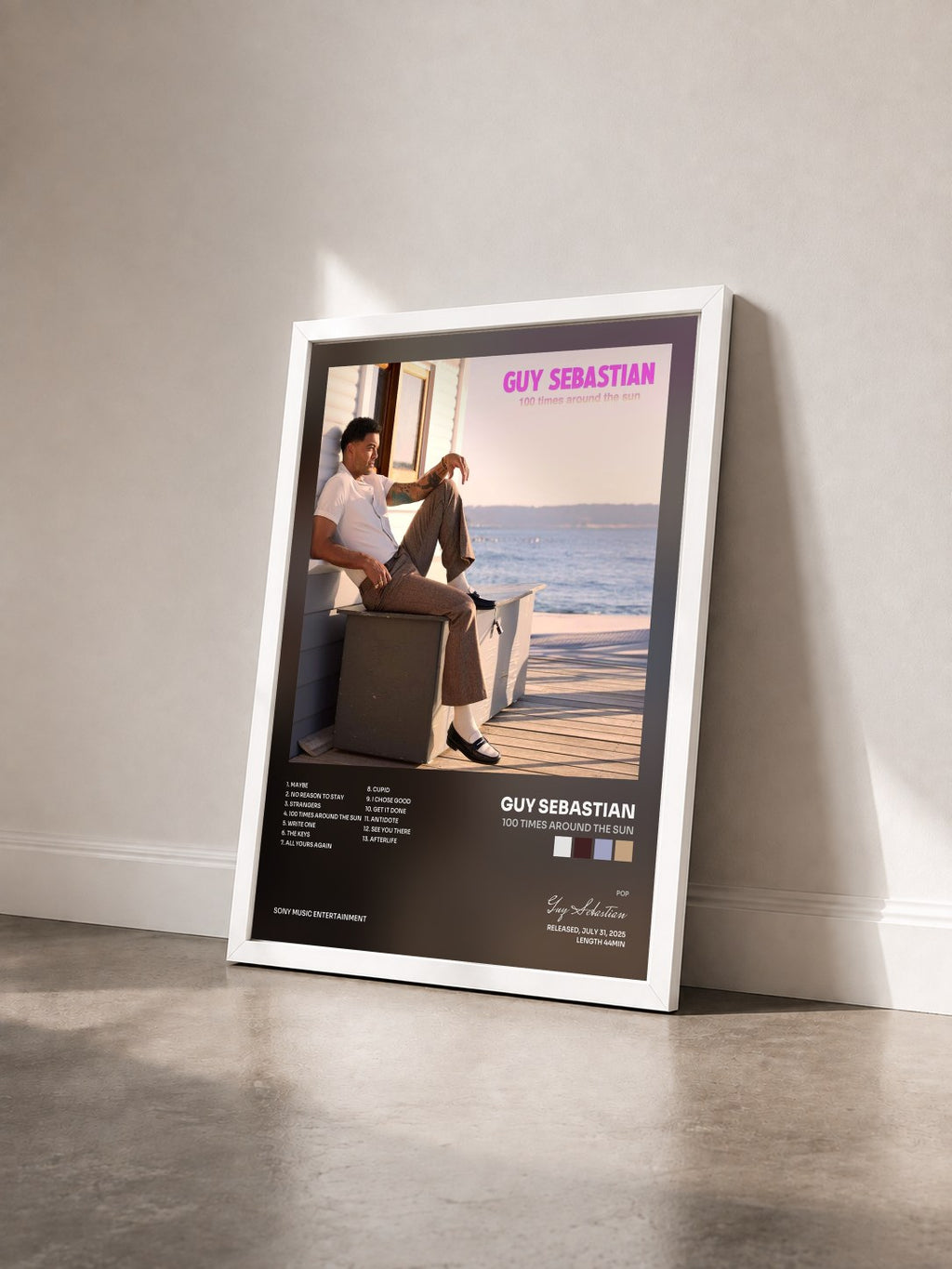 #blanc 100 Times Around the Sun by Guy Sebastian as a framed art print seen at an angle, white frame