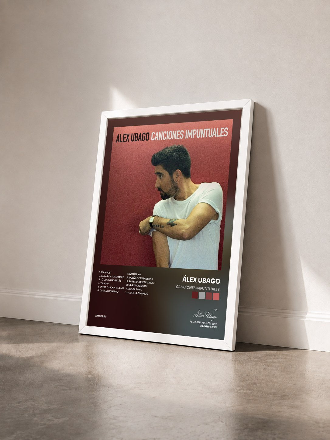 #blanc Tableau de l'album Canciones impuntuales de Álex Ubago vu de trois quarts, cadre blanc