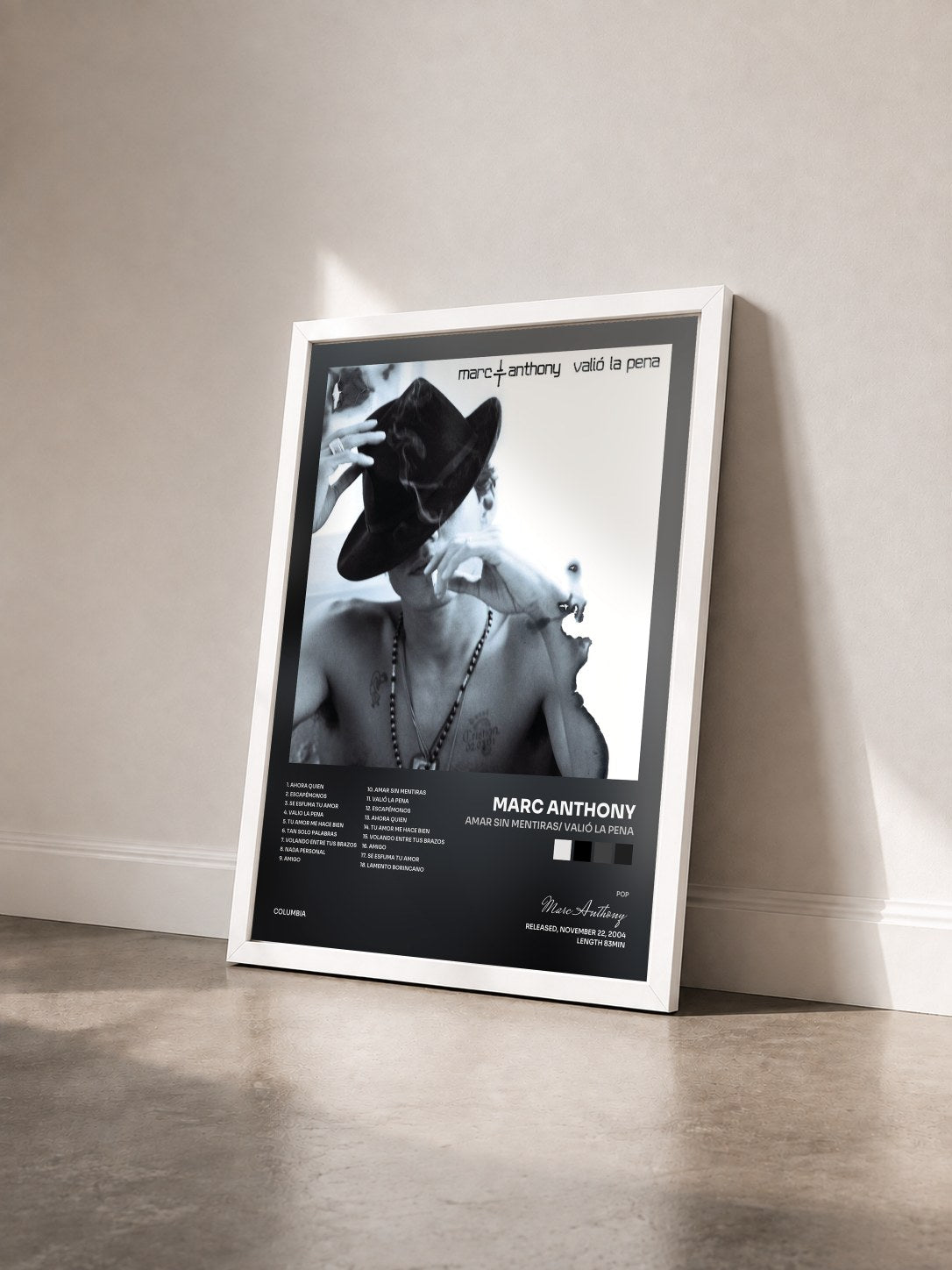 #blanc Tableau de l'album Amar Sin Mentiras/ Valió La Pena de Marc Anthony vu de trois quarts, cadre blanc