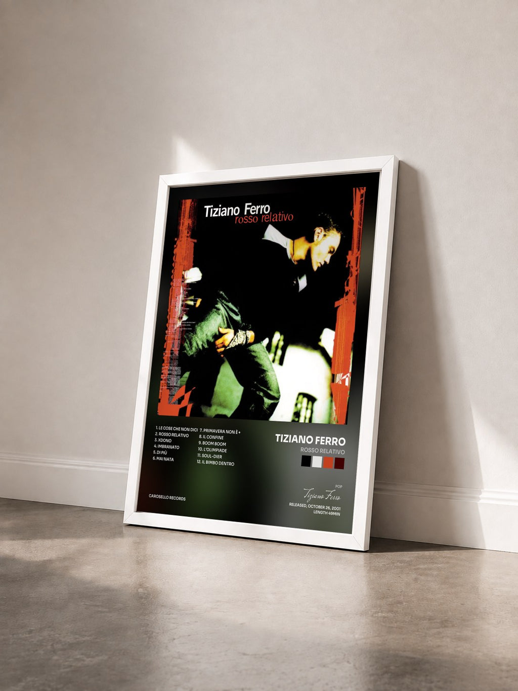 #blanc Tableau de l'album Rosso relativo de Tiziano Ferro vu de trois quarts, cadre blanc