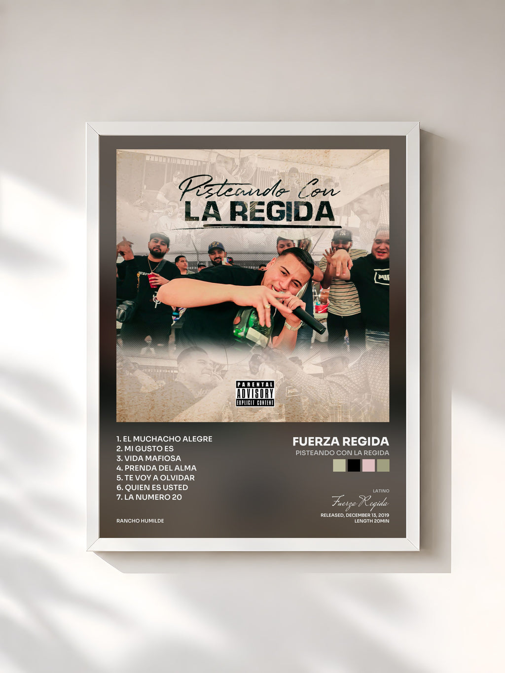 #blanc Pisteando Con La Regida by Fuerza Regida as a framed art print, white frame, printed and framed in France