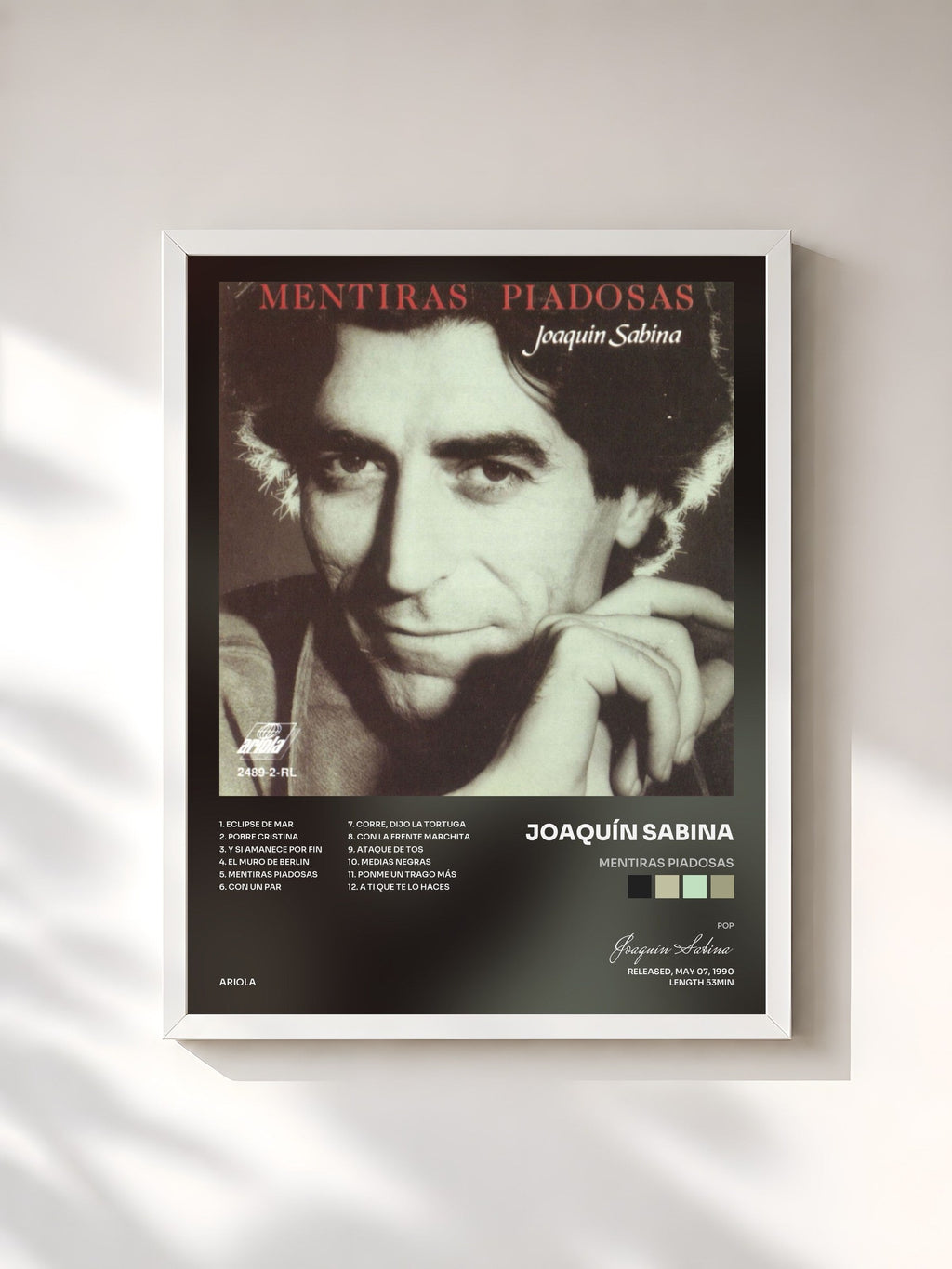 #blanc Mentiras Piadosas by Joaquín Sabina as a framed art print, white frame, printed and framed in France
