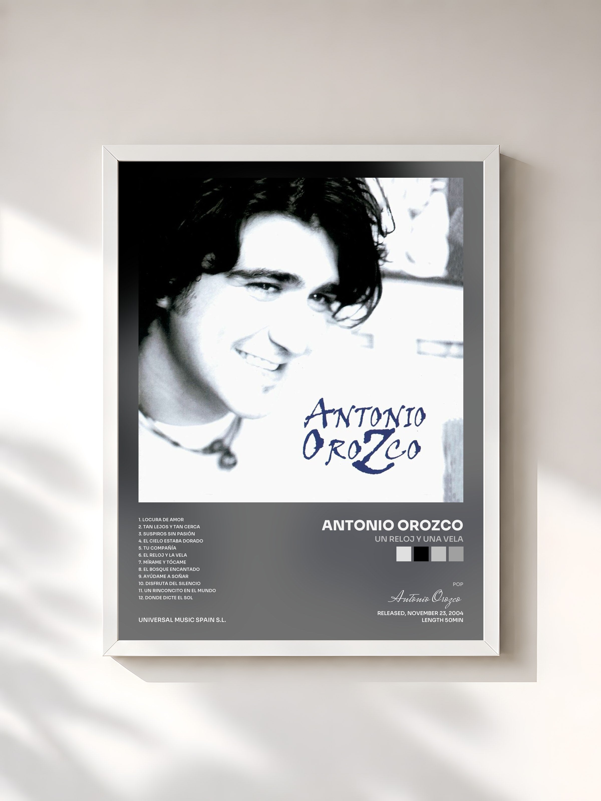 #blanc Tableau de l'album Un Reloj Y Una Vela de Antonio Orozco, cadre blanc, imprimé et encadré en France