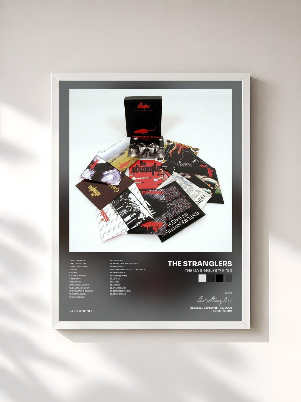 #blanc The UA Singles '79-'82 di The Stranglers in stampa incorniciata, cornice bianca, stampata e incorniciata in Francia