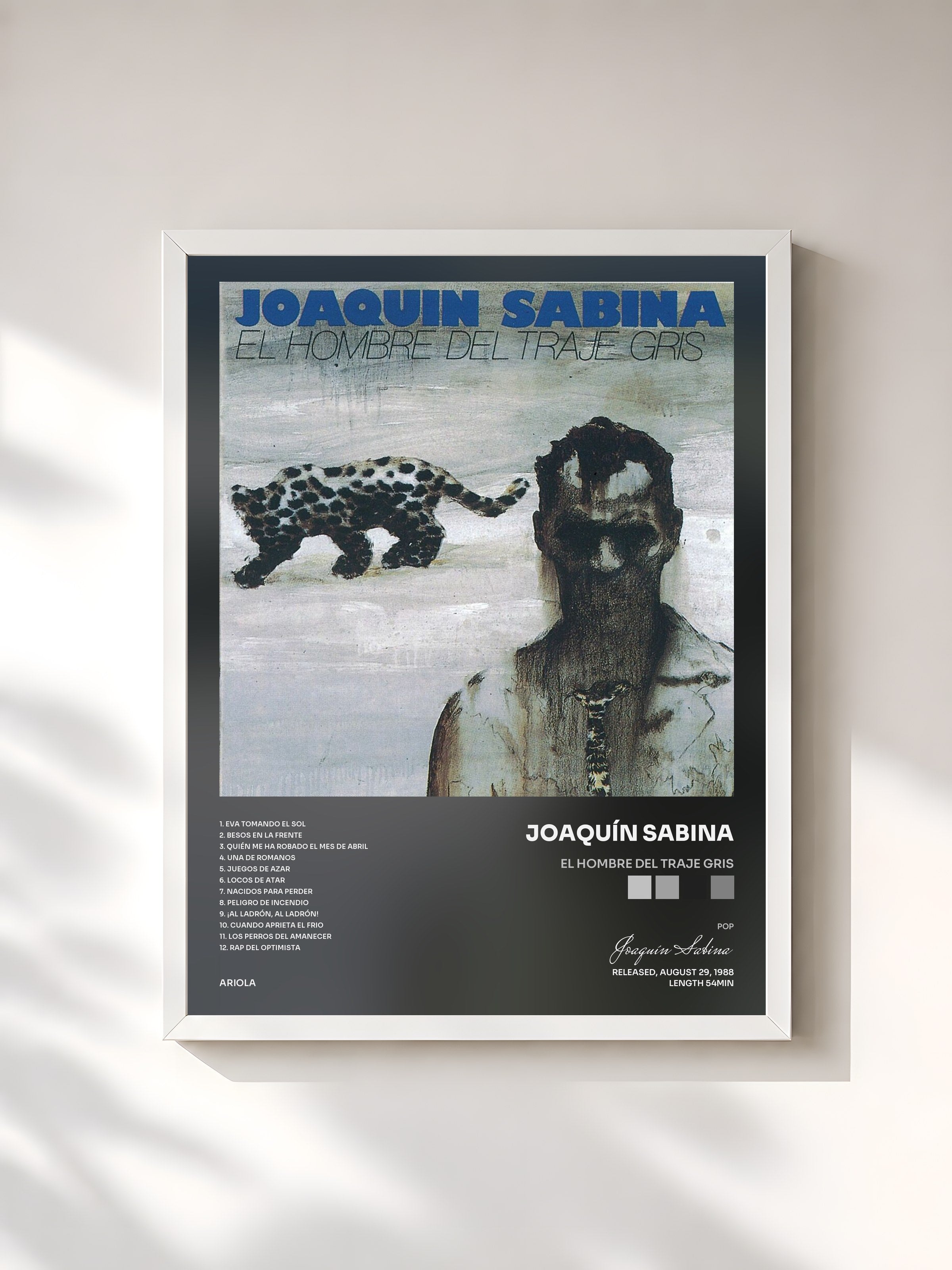 #blanc Tableau de l'album El Hombre Del Traje Gris de Joaquín Sabina, cadre blanc, imprimé et encadré en France