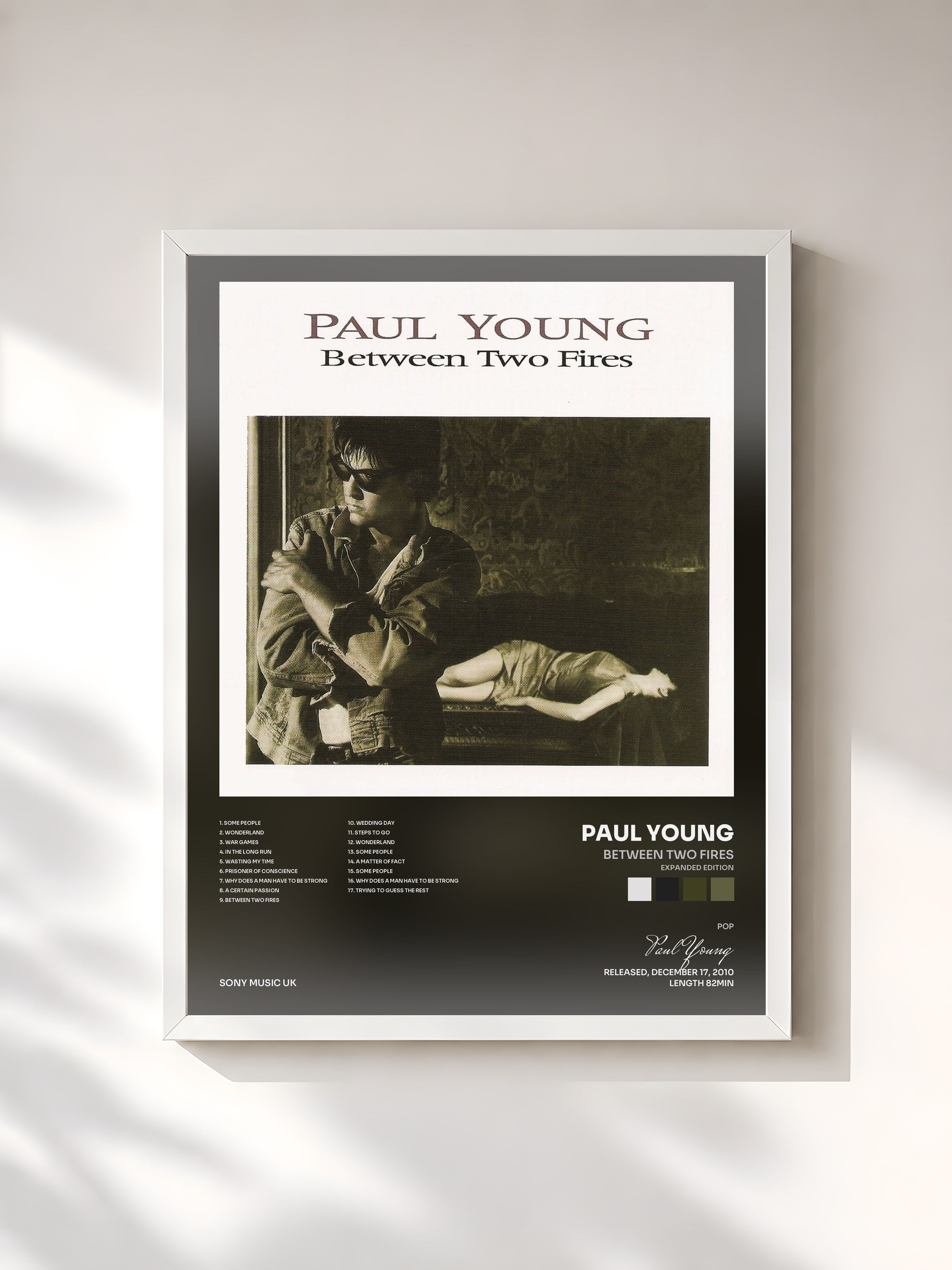 #blanc Tableau de l'album Between Two Fires (Expanded Edition) de Paul Young, cadre blanc, imprimé et encadré en France