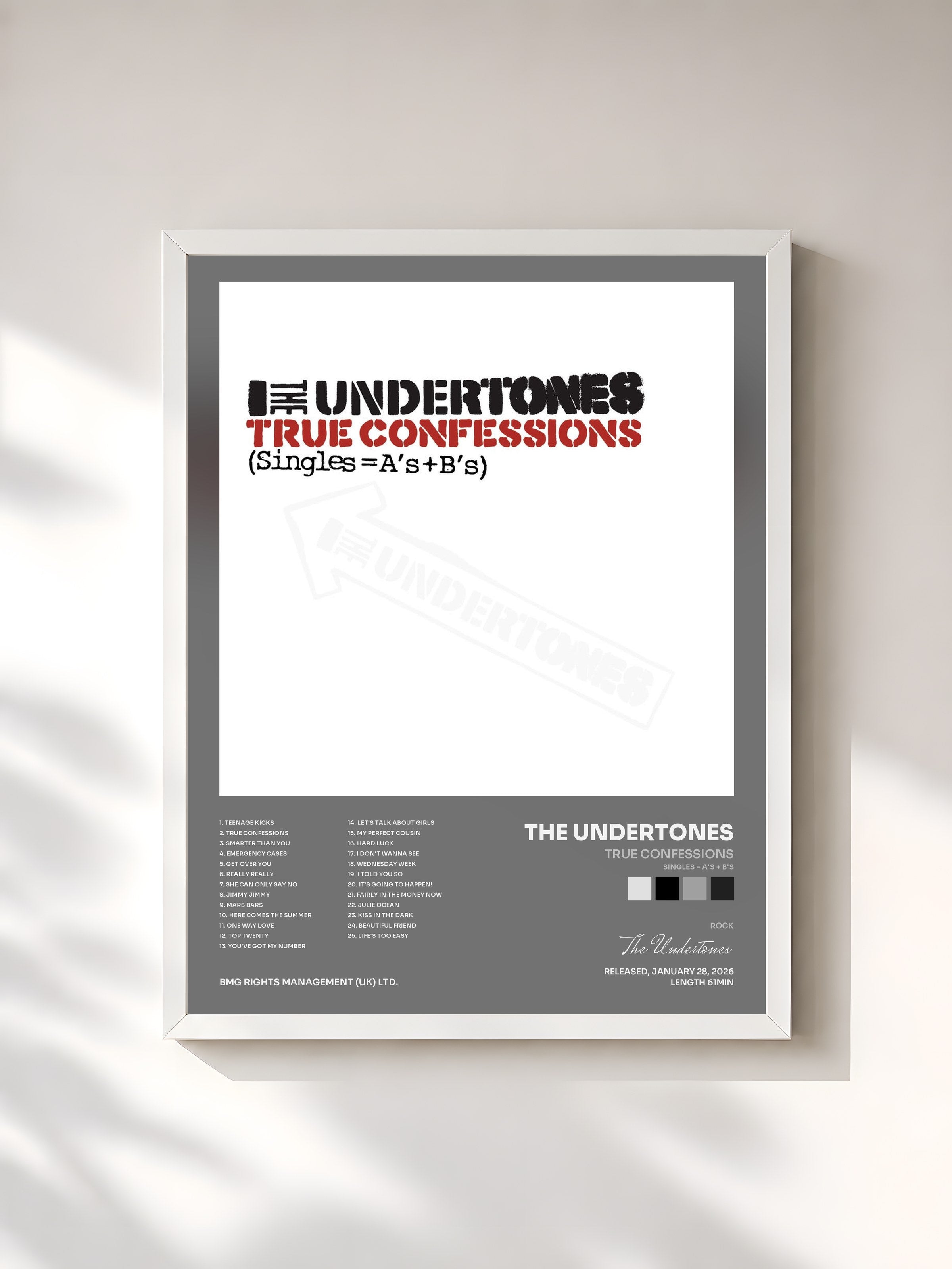 #blanc Tableau de l'album True Confessions (Singles = A's + B's) de The Undertones, cadre blanc, imprimé et encadré en France