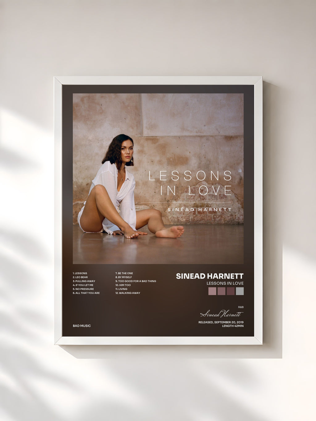 #blanc Lessons in Love by Sinead Harnett as a framed art print, white frame, printed and framed in France