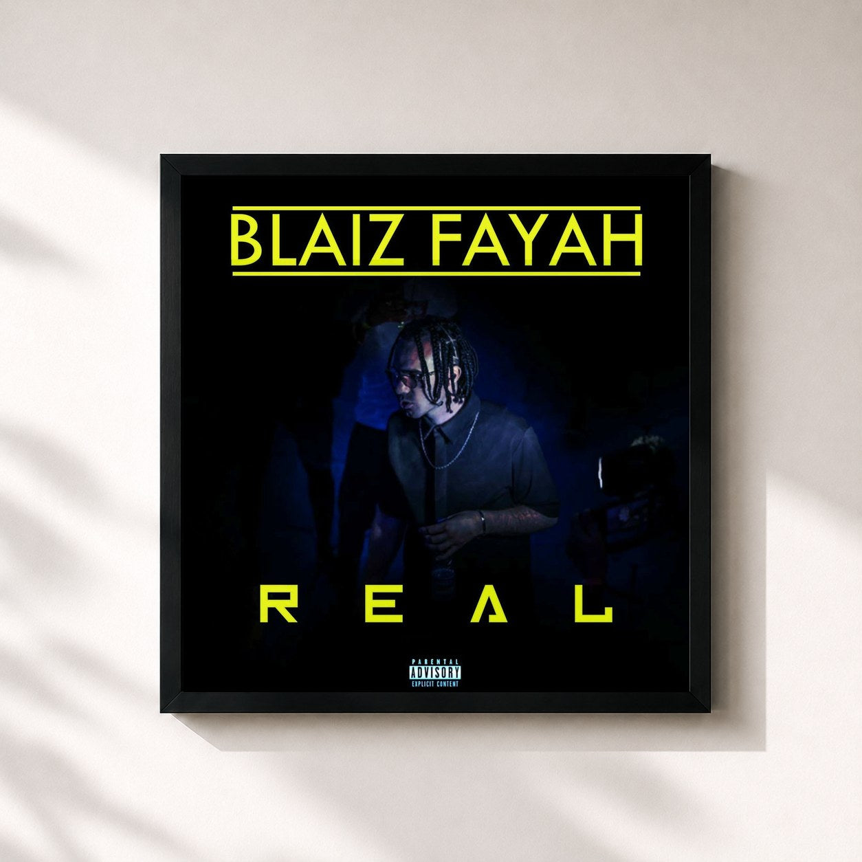 #noir Tableau carré de l'album Real de Blaiz Fayah, cadre noir 32x32 cm