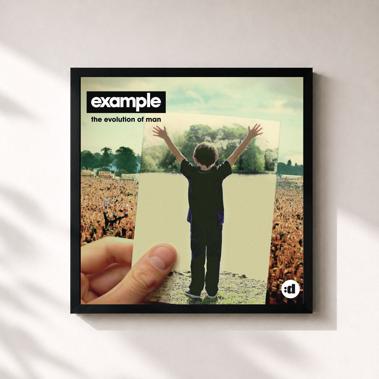#noir Tableau carré de l'album The Evolution of Man de Example, cadre noir 32x32 cm