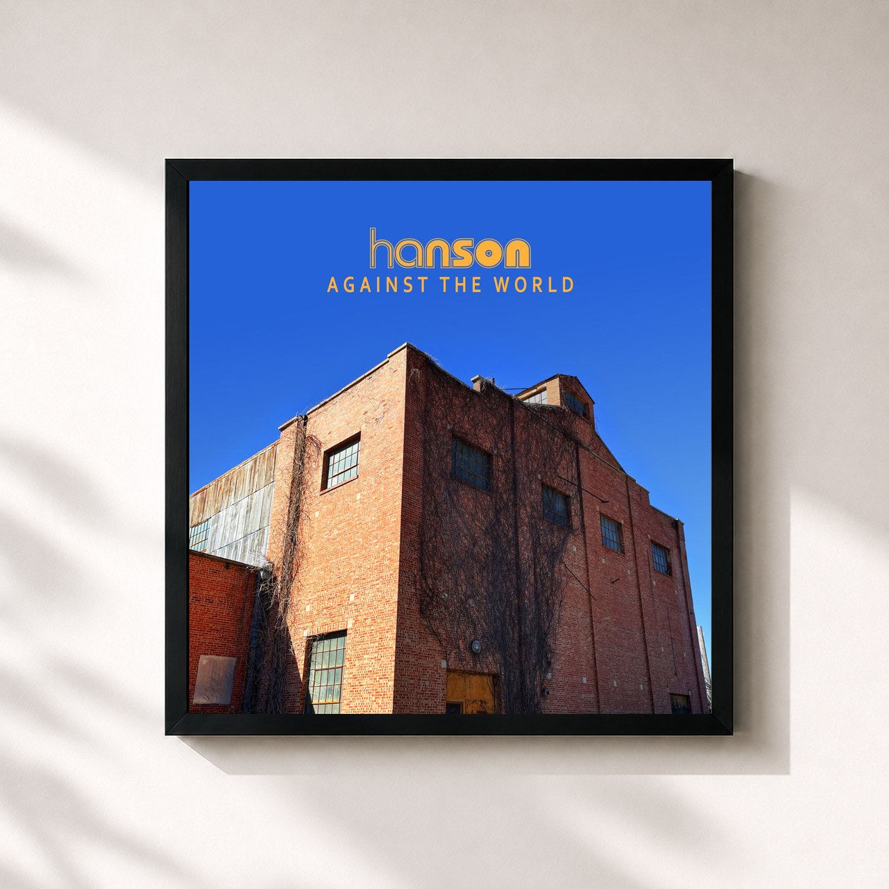 #noir Tableau carré de l'album Against the World de Hanson, cadre noir 32x32 cm