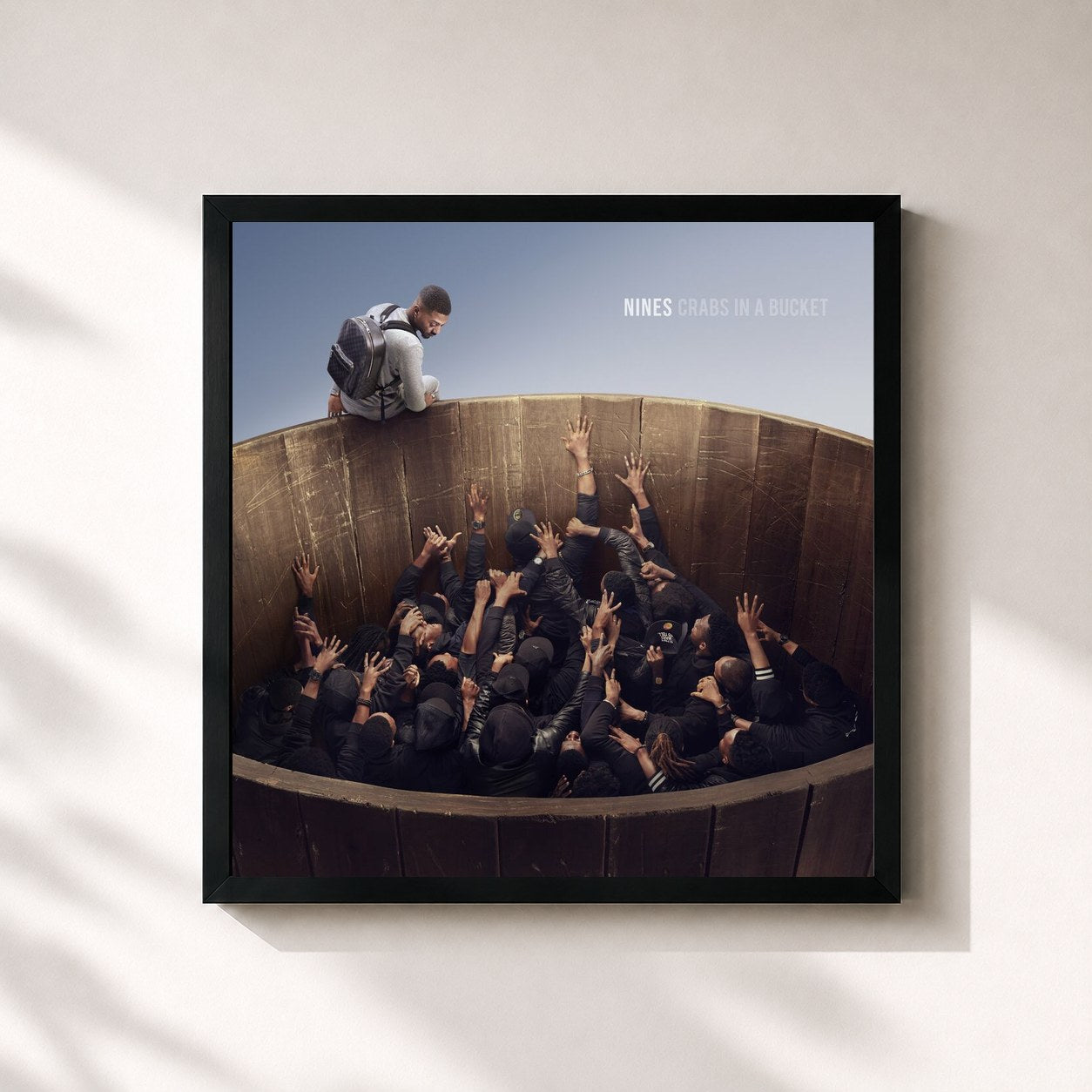 #noir Tableau carré de l'album Crabs In A Bucket de Nines, cadre noir 32x32 cm
